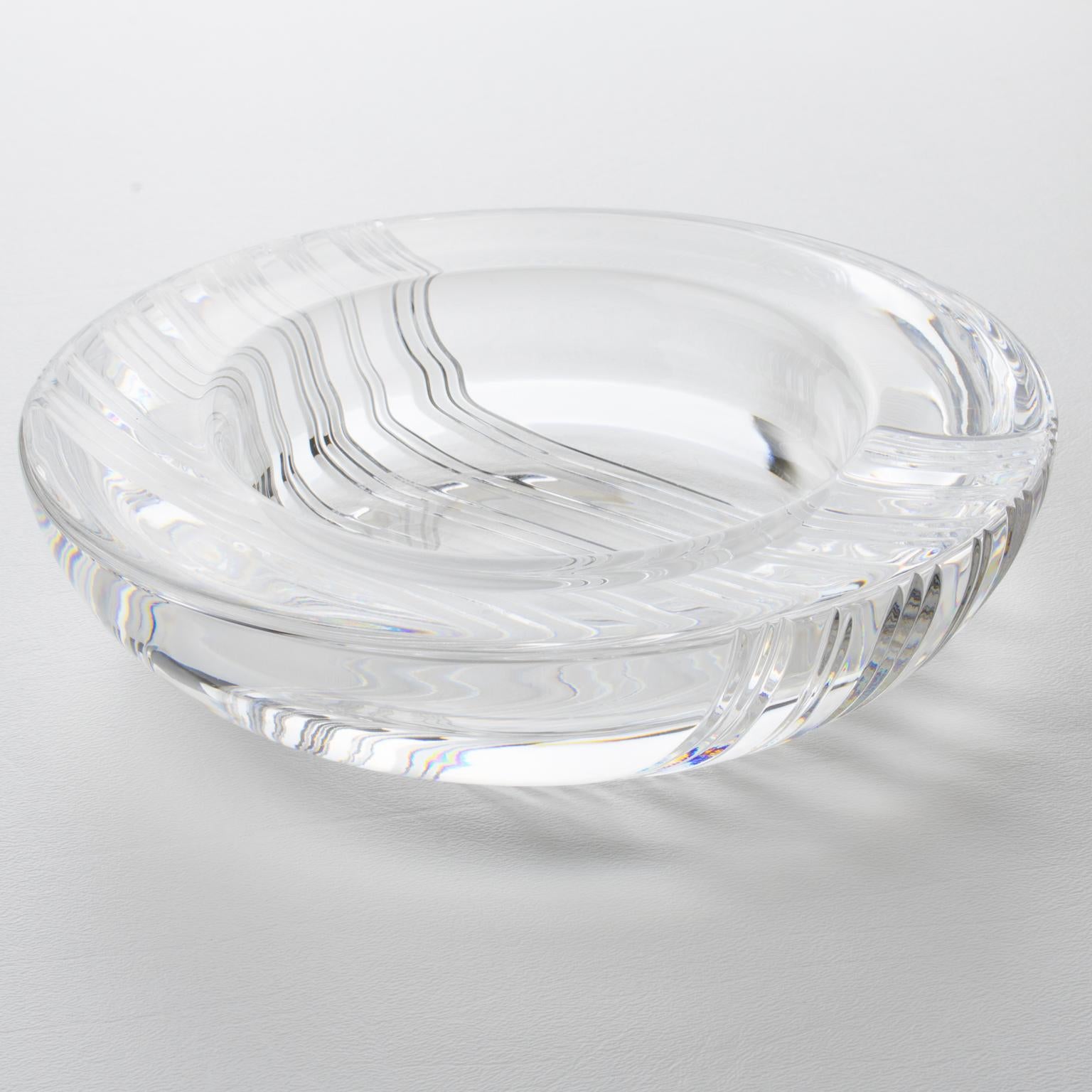 This exquisite Christian Dior crystal centerpiece, or vide poche, is the perfect addition for a touch of luxury to any room. The piece was crafted in France for Christian Dior Interior circa 1980. The intricate and heavily carved pattern is