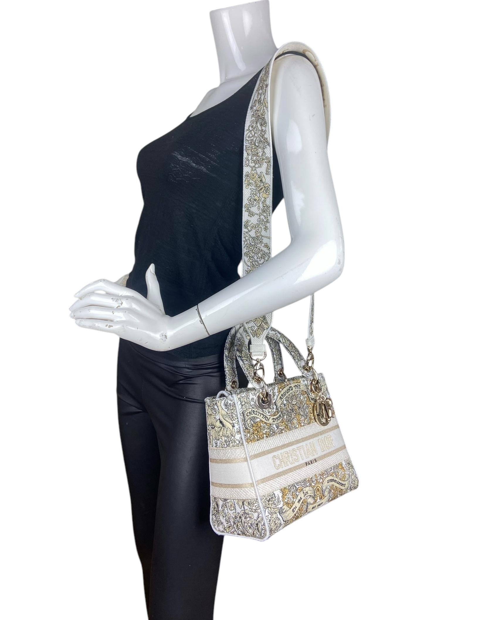 Christian Dior Latte Embroidery Around the World Motif Medium Lady D-Lite Bag. The latte style is fully embroidered with the gold-tone Dior Around the World motif by Pietro Ruffo, showcasing a star decorated with flowers in honor of Scottish