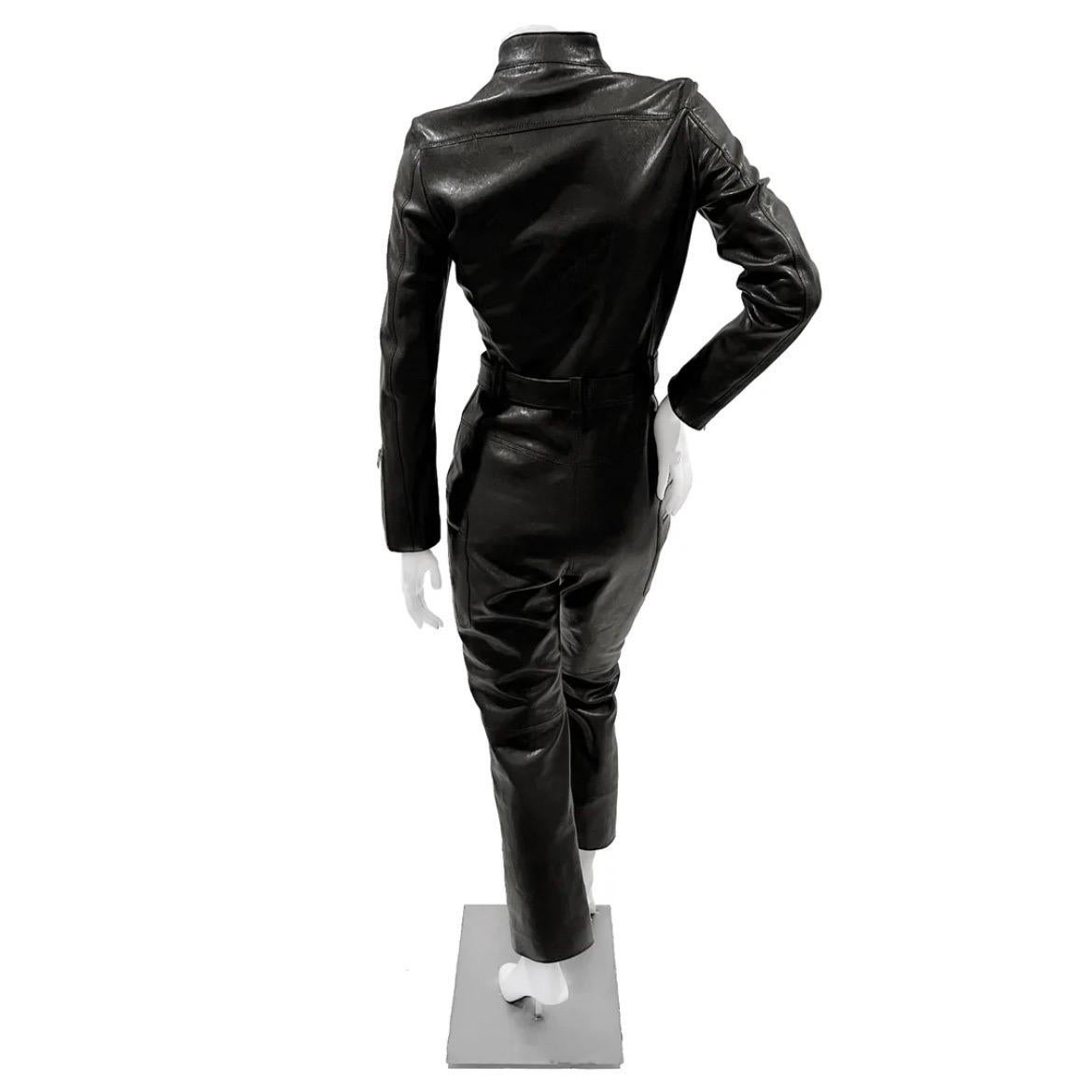 Leather Long Sleeve Jumpsuit by Maria Grazia Chiuri for Christian Dior
Autumn 2020 Ready-To-Wear
Made in Italy
Black lamb leather
Large front zip closure
Long sleeve
Silver tone hardware
Snap button closure around neck
Adjustable removable