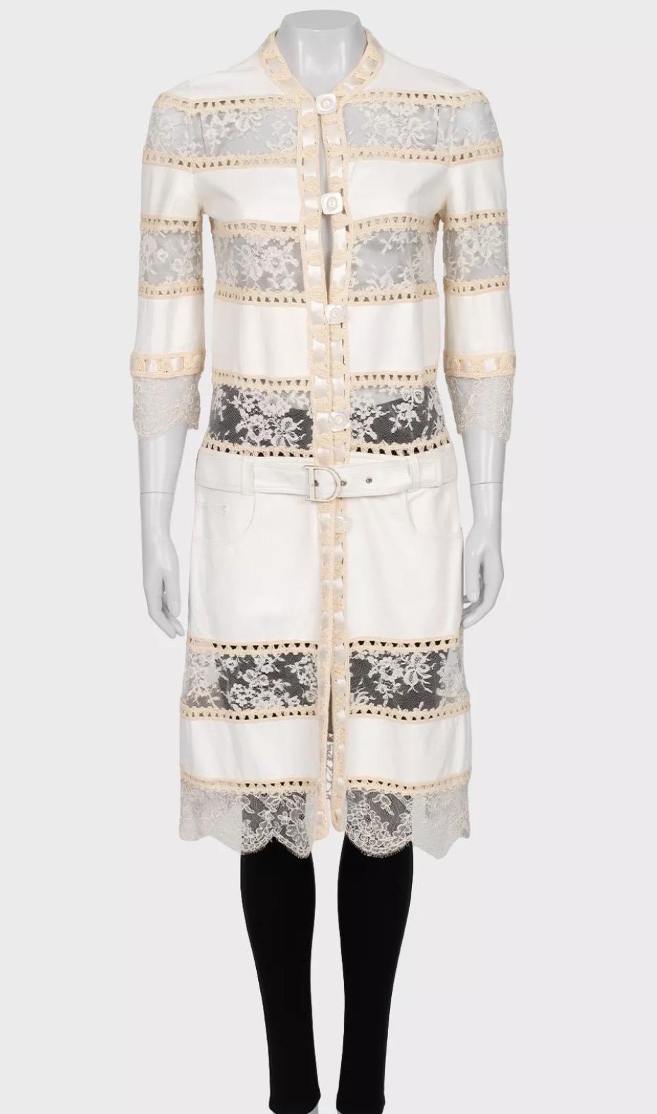 Step into the world of high fashion with this rare Christian Dior cardigan from the Spring-Summer 2005 collection, designed by the iconic John Galliano. This exquisite piece is crafted from 100% leather, beautifully contrasted with delicate cotton