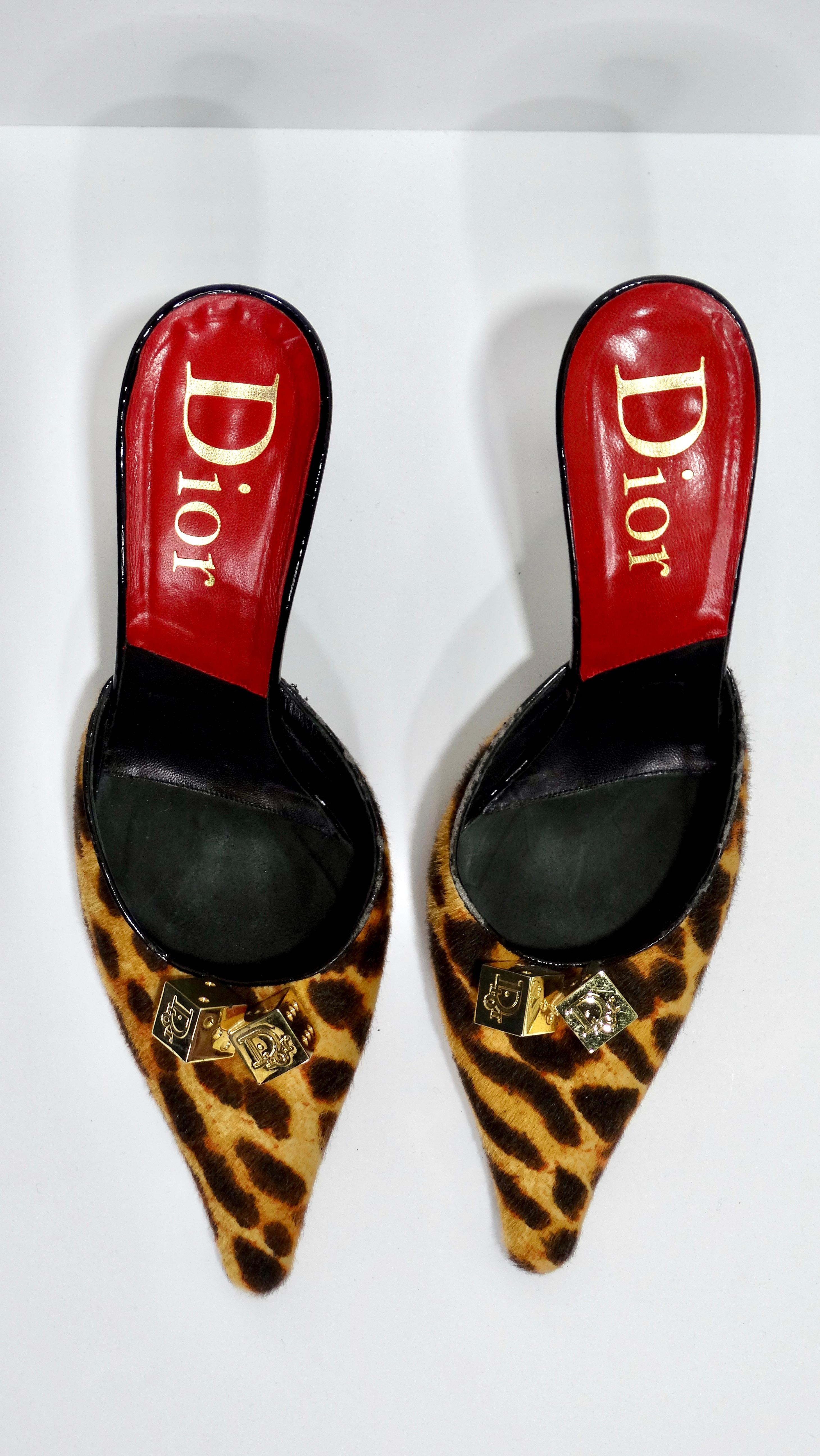 You need these fun Christian Dior mules in your collection! From the 2004 Fall runway collection design by none other than John Galliano. These mules are featured in a brown and tan leopard print pony hair, a semi pointed-toe, 4-inch heal, black and