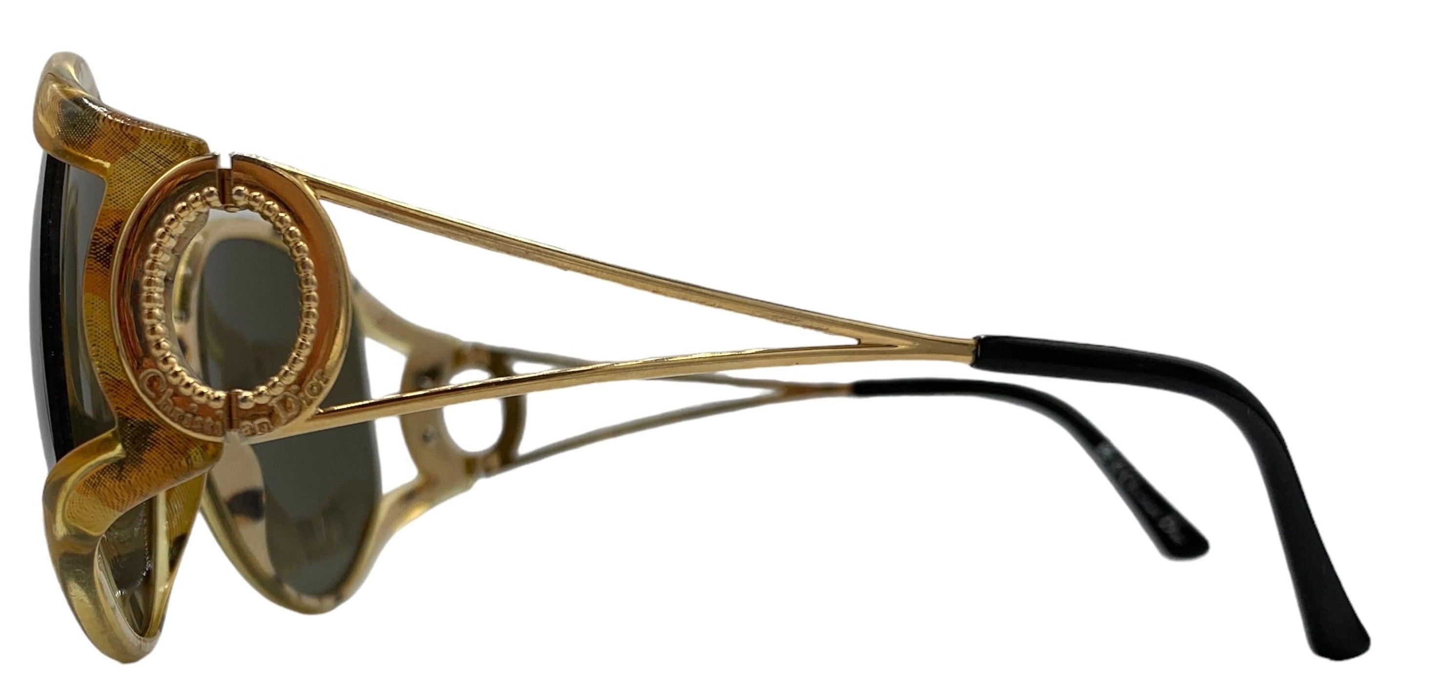 Discover the legendary Christian Dior 1980s 2757 50 model SUNGLASSES, A pair of oversized leopard print sunglasses that exude sophistication and style. This striking accessory features a combination of plastic and metal for a timeless and daring