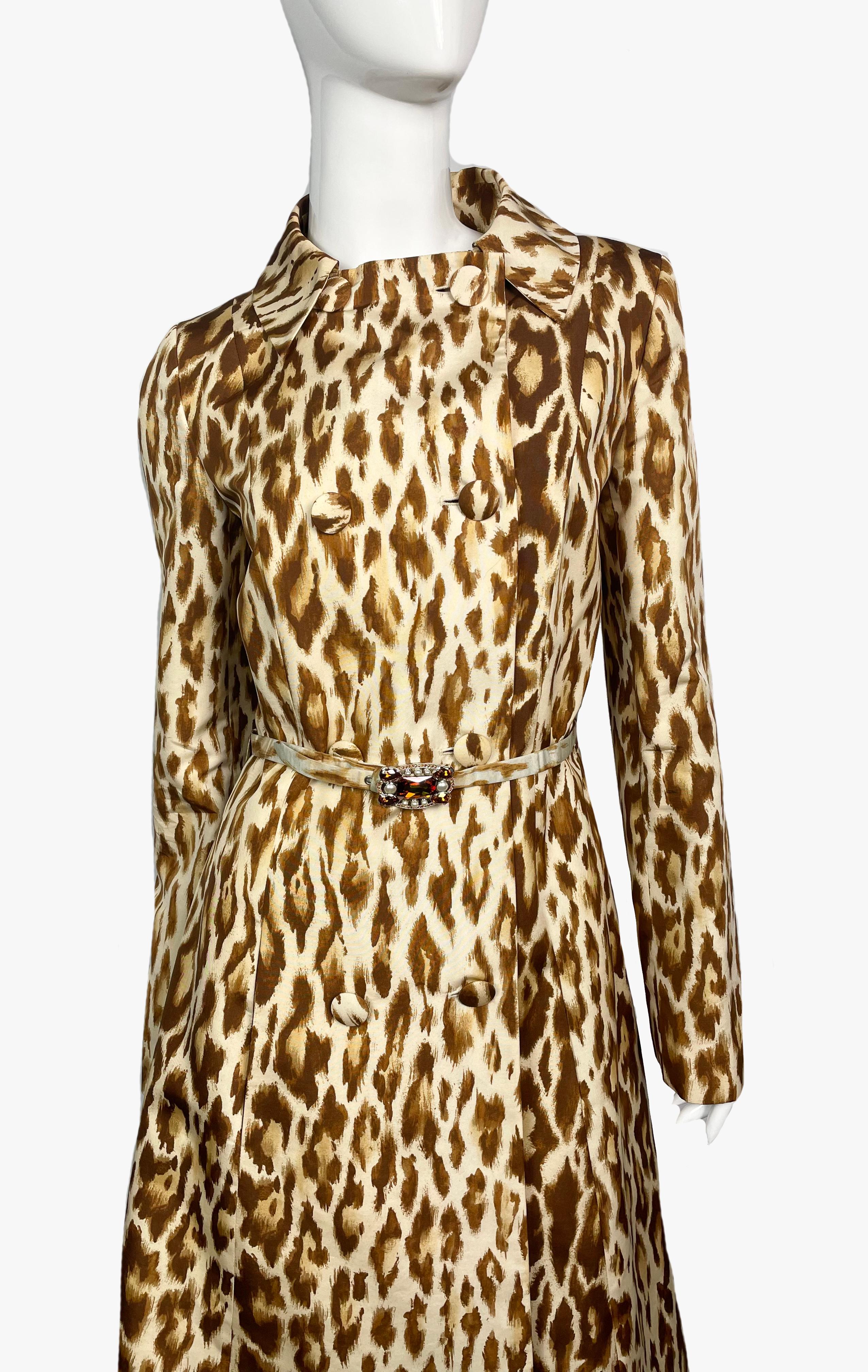 Christian Dior leopard print silk trench from Resort 2008 collection. 
Beige, brown colors.
Includes belt, buckle trimmed with stones and pearls. 
Button fastening, 2 pockets, fully lined. 
Composition:  100% silk, lining 100% silk
Condition: very