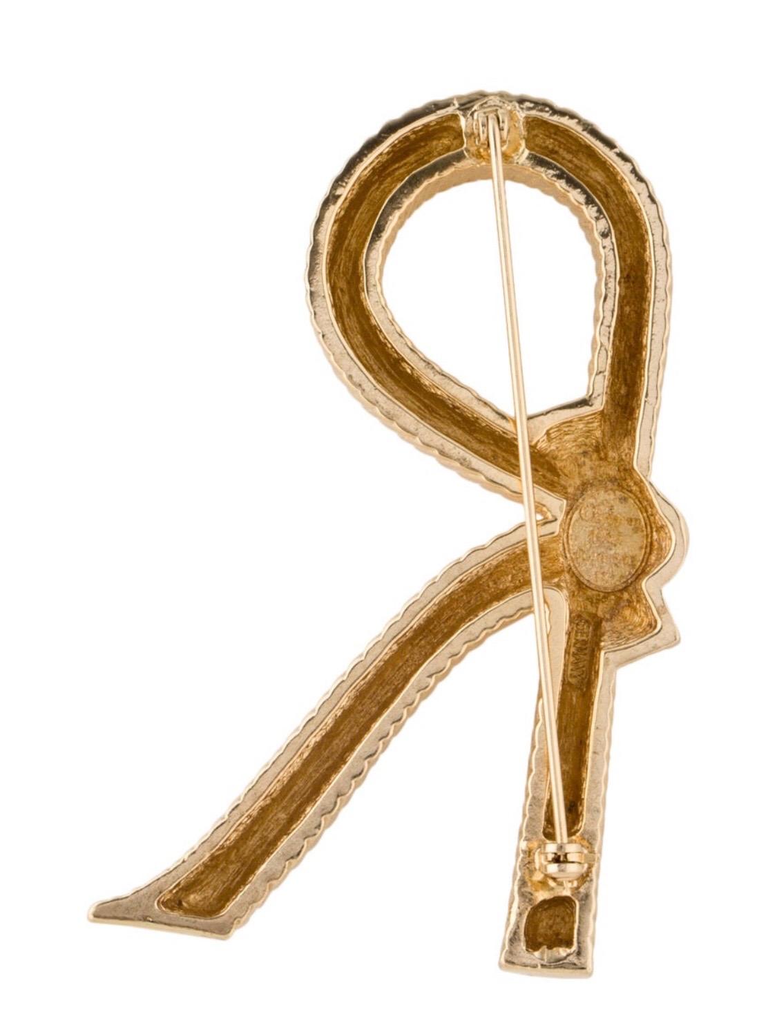 Make a statement with our CHRISTIAN DIOR Vintage Initial 'R' Crystal Accented Brooch. Its the perfect accent piece for any look. Pin her on your hat or handbag or your favorite blazer. Designed by Christian Dior in the 1960s marked Christian Dior