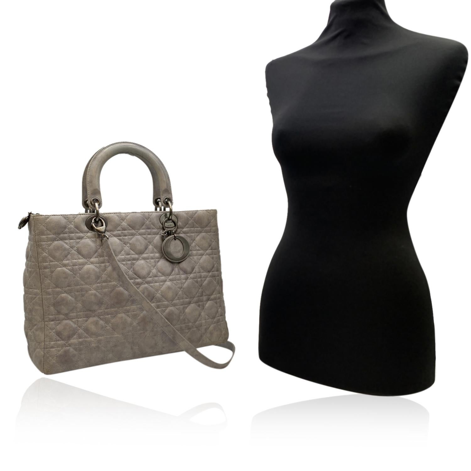 Timeless and unique work of art, the LADY DIOR bag has all the Couture spirit of Dior. Crafted by hand, this light grey leather bag is enhanced by iconic Dior 'Cannage' stitching. The iconic 'cannage' pattern by CHRISTIAN DIOR is inspired by the