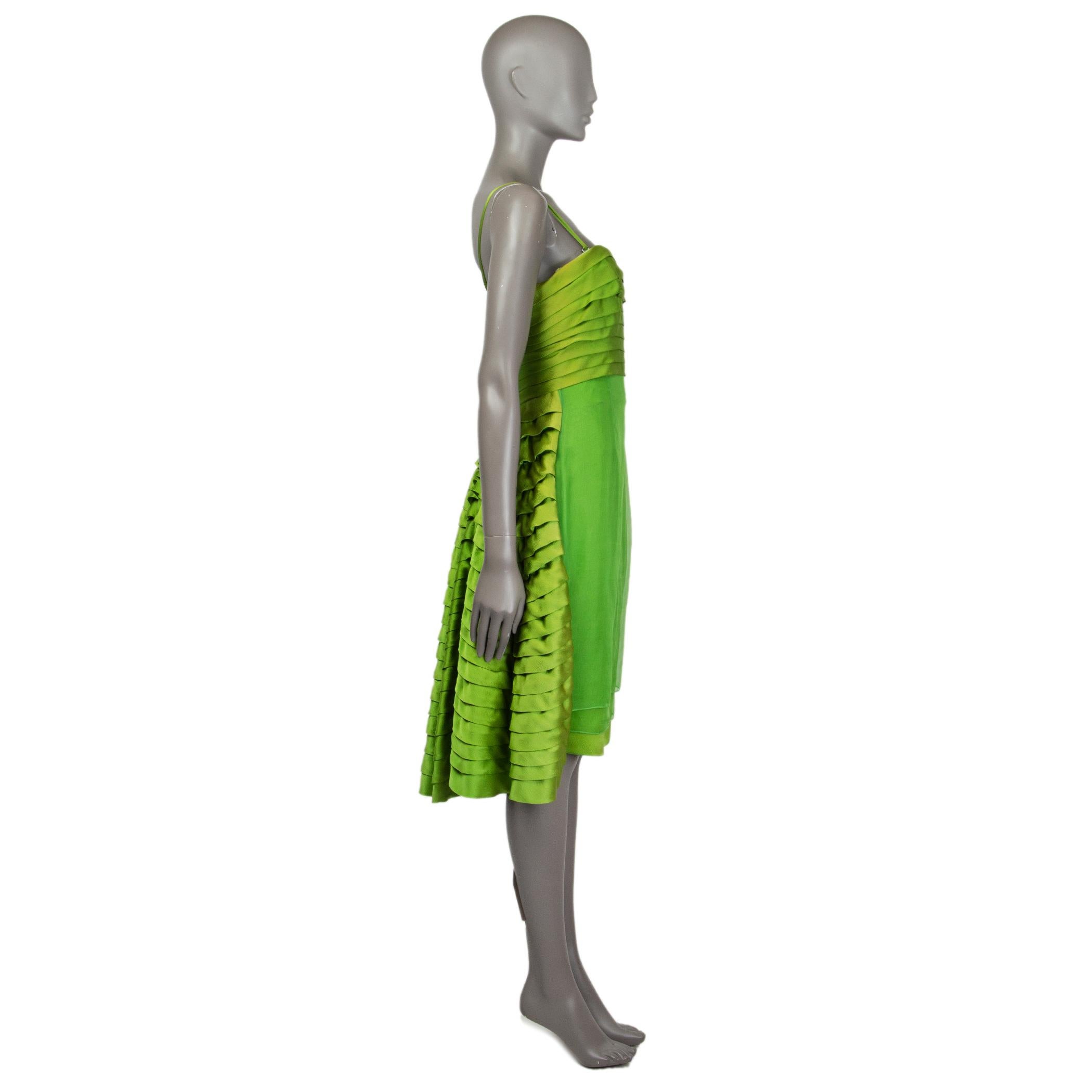 Christian Dior dress in chartreuse silk organza and satin (100%). With phorizontal pleating around the bust, wired bustier, ruffled panel on the back side, and layered skirt. Features removable shoulder straps. Closes with invisible zipper on the
