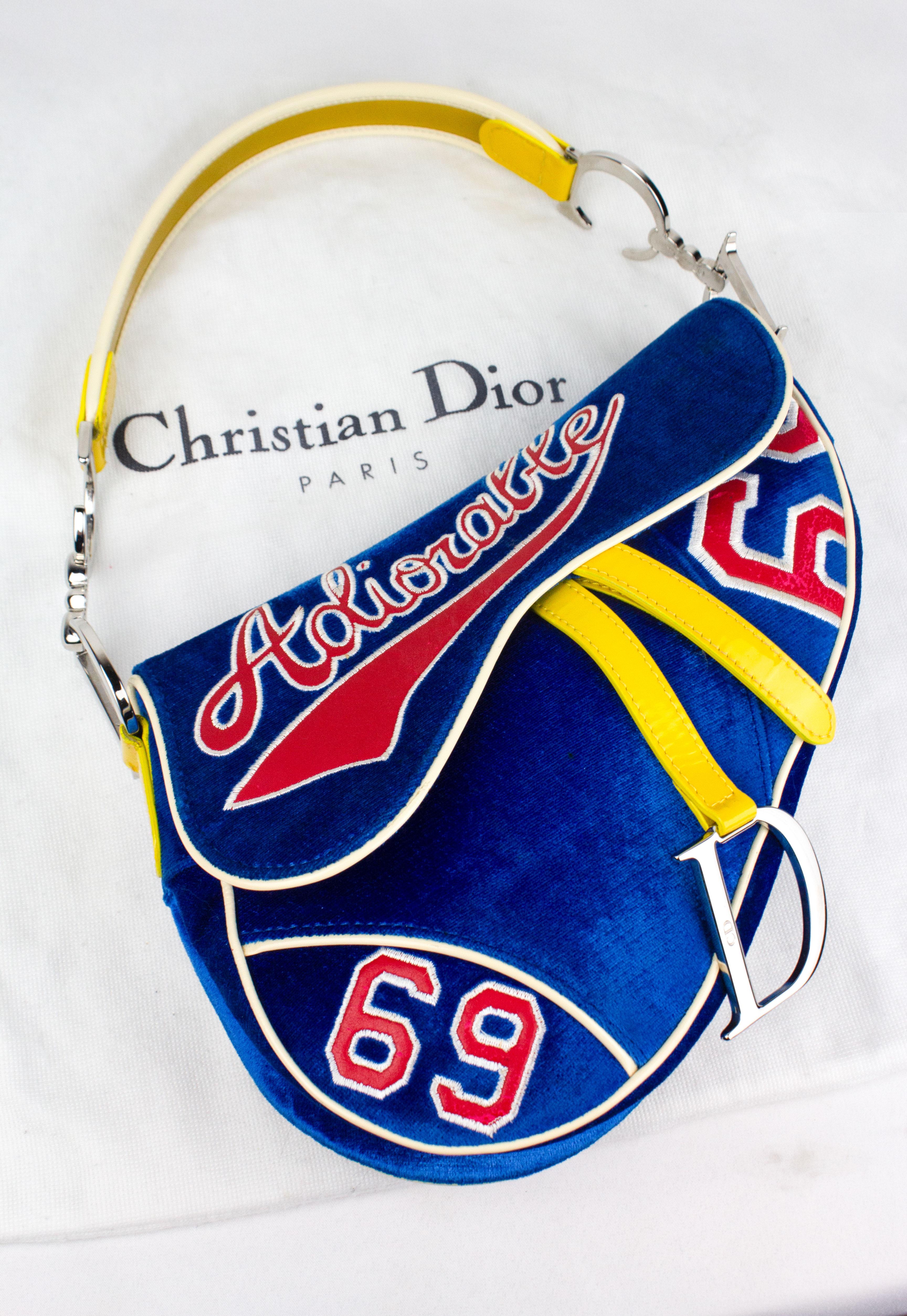 Vintage limited edition Christian Dior by John Galliano 'Adiorable' saddle bag, identical to one recently seen on Rihanna. Blue velvet with yellow patent leather details. Silver toned hardware.

Condition
Excellent. Some signs of aging to the red