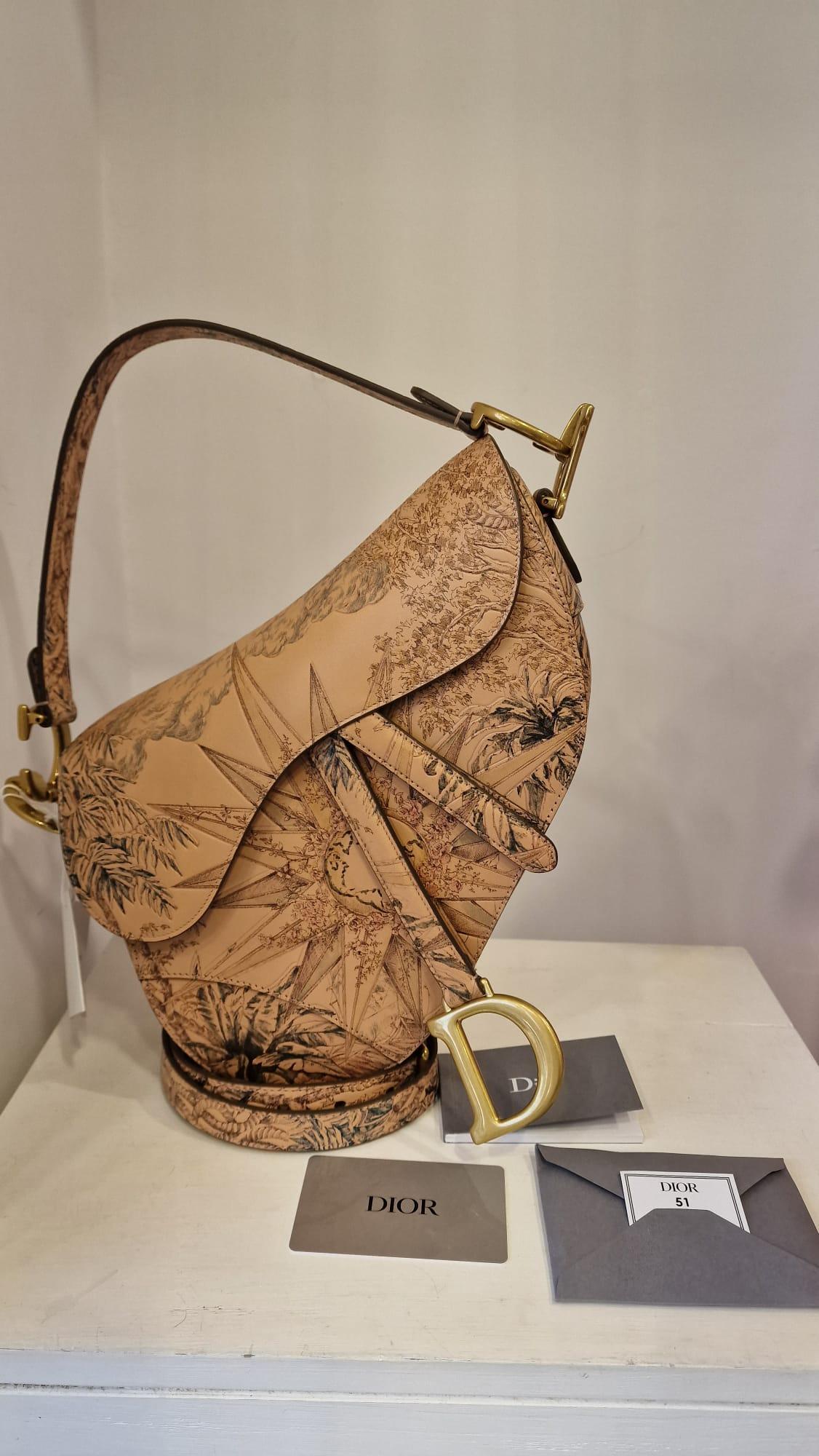 Christian Dior limited edition saddle bag NWOT
Leather saddle bag embellished with sun design
