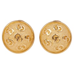 Boucles d'oreilles boutons avec logo Christian Dior 