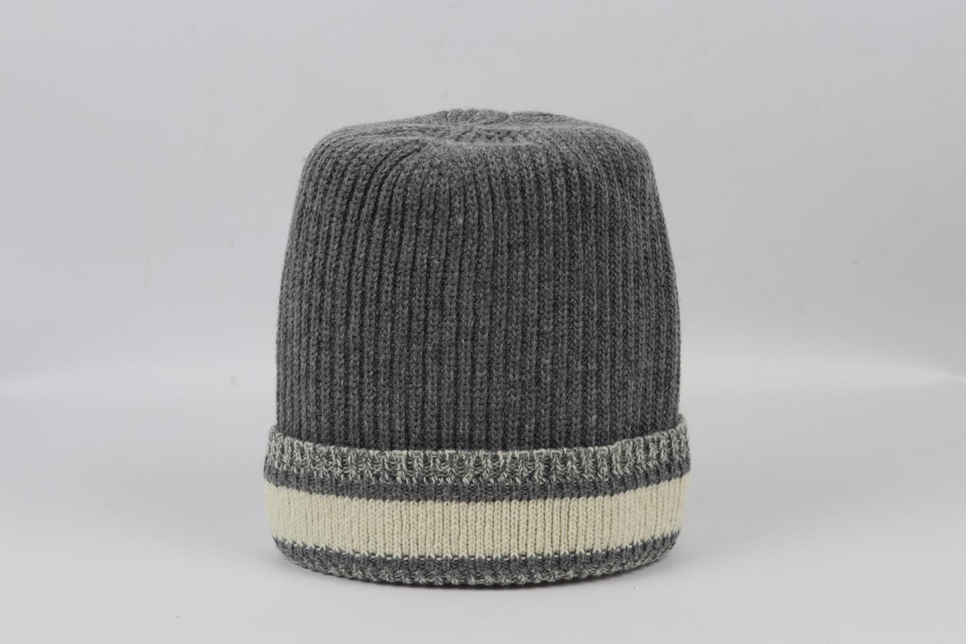 Christian Dior logo intarsia wool and cashmere blend ribbed beanie. Grey and cream. Slips on. 70% Wool, 30% cashmere. Does not come with dustbag or box. Length: 11.25 in. Circumference: 18 in. Very good condition - Worn once. No sign of wear; see