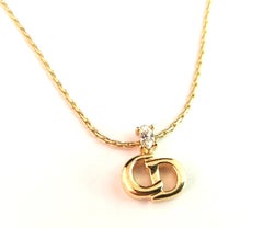 Christian Dior logo pendant necklace, gold tone, paste
