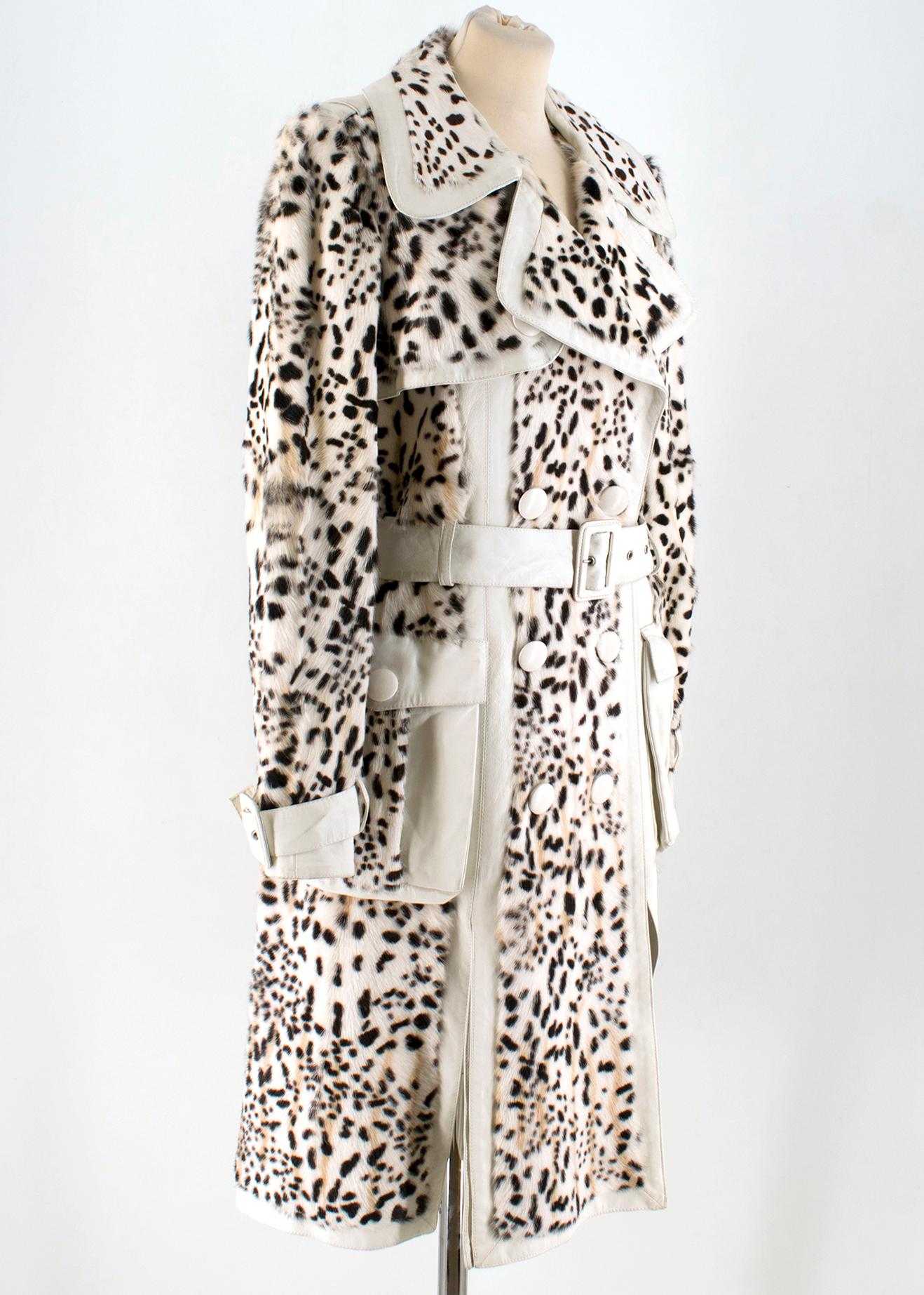 Christian Dior Lynx Print Leather and Goat Fur Coat 

- White and Black Coat 
- Lynx Spotty Printed 
- White lambskin leather 
- Goat details 
- Wide lapel, double breasted 
- Dual side pockets
- Leather belt at waist
- Belted sleeves
- Silk