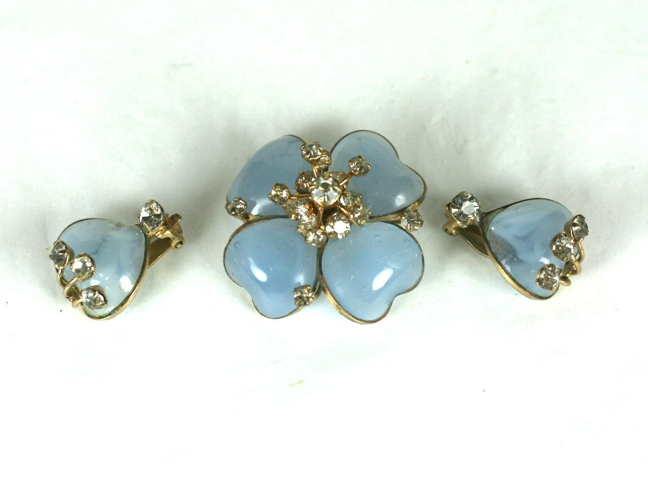 Christian Dior Maison Gripoix Demi Paure, consisting of a flower brooch and petal ear clips. Of blue moon stone poured glass enamel, with crystal paste accents. Excellent Condition. 
Ear clips L 3/4