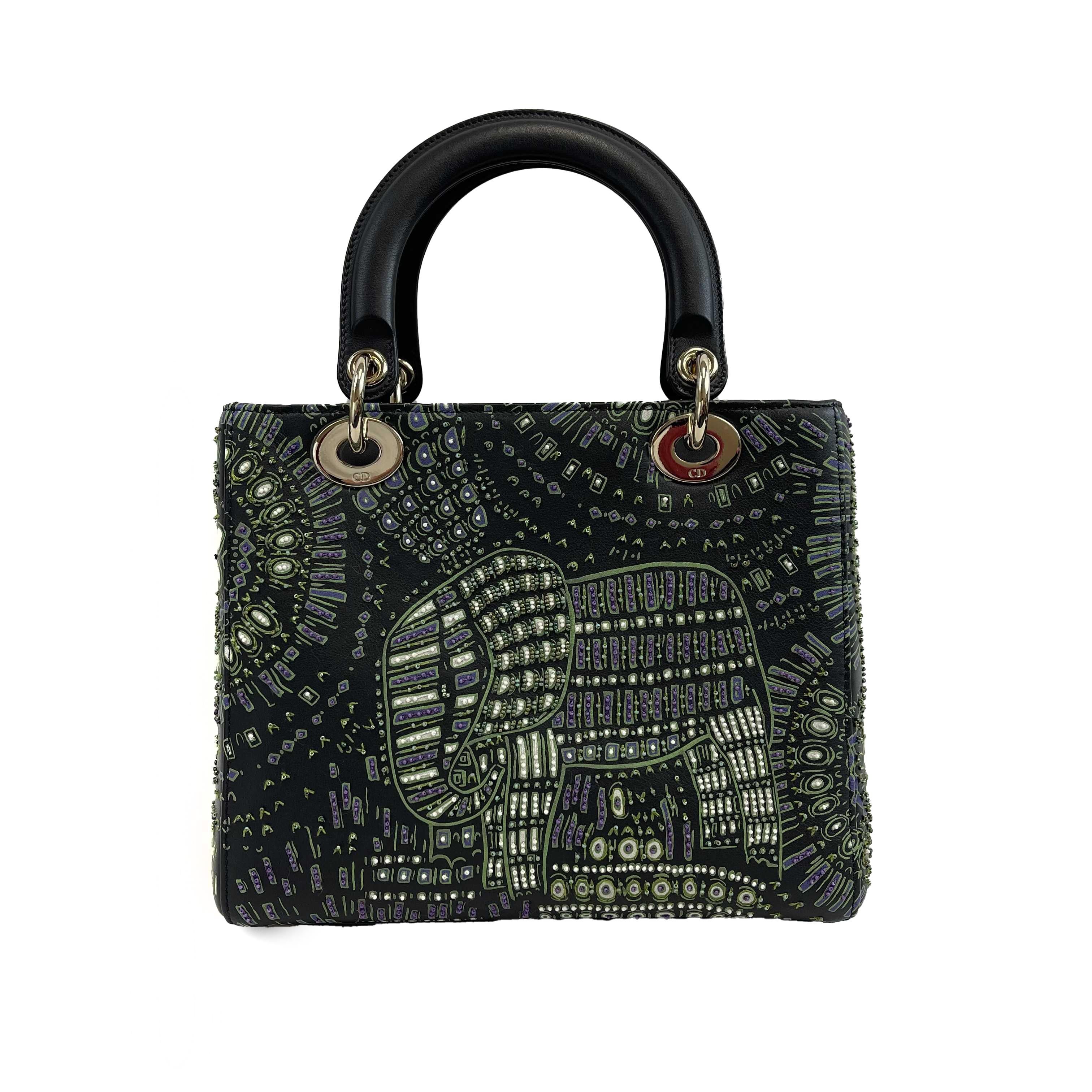 Christian Dior - Excellent - Embroidered Animals Medium Lady Dior - Black, Green, Purple - Handbag

Description

* Black leather
* Purple, white, green beading
* Double handle
* Adjustable and removable shoulder strap
* Silver hardware
* Four