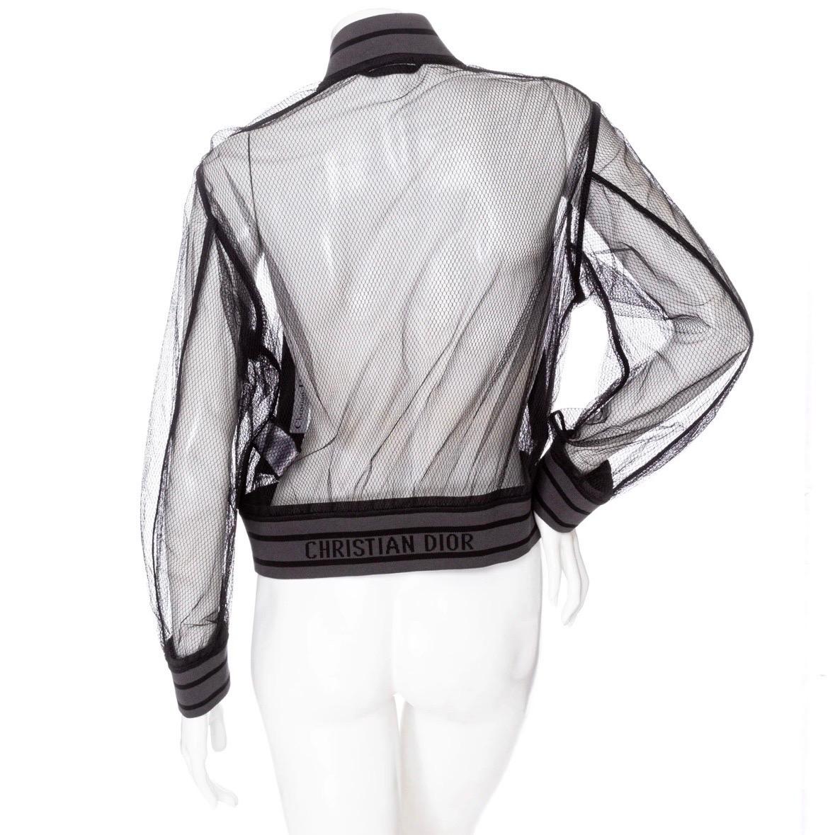 Christian Dior Mesh Jacket 

Black/Gray
Semi sheer
Double sided mesh
Ribbed knit contrast
Striping on cuffs, neck, and waist
Back logo detail
Front kangaroo pockets
Zip closure front
Made in Italy
100% polyamide; 100% polyamide other materials; 81%