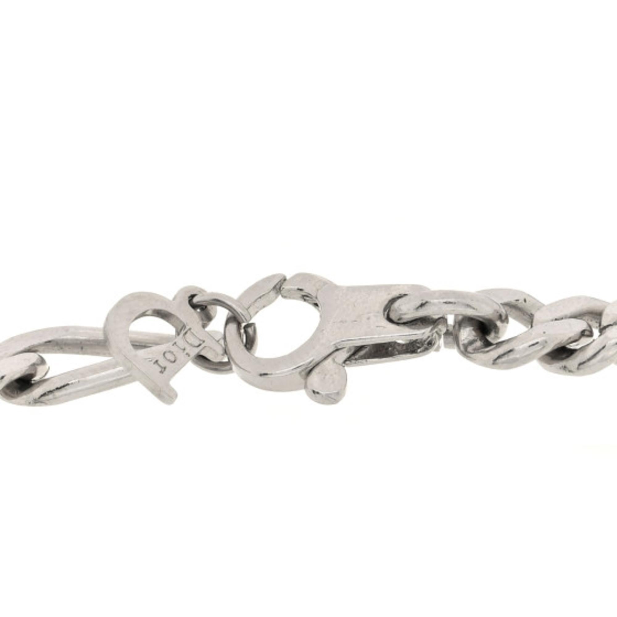 Elevate your accessory game with our exquisite Silver Charm Bracelet, a stunning piece crafted from high-quality silver-tone metal. This elegant figaro chain features three unique charms: a chic coin charm, a heart charm symbolizing love, and two