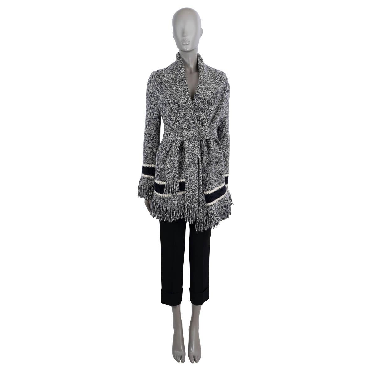 100% authentic Christian Dior mélange belted oversized wrap cardigan in midnight blue and white wool (70%) and cashmere (30%). Features a wide shawl collar, fringed bottom hem, cuffs and belt ends, navy blue and white stripe at the cuffs and bottom