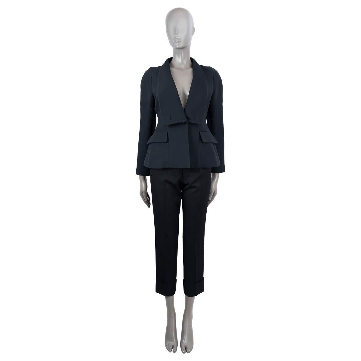 100% authentic Christian Dior tuxedo jacket in midnight blue wool (77%) and silk (23%). Features a wide shawl collar adn two flap pockets. Closes with a button on the front. Lined in silk (100%). Has been worn and is in excellent condition.

2018