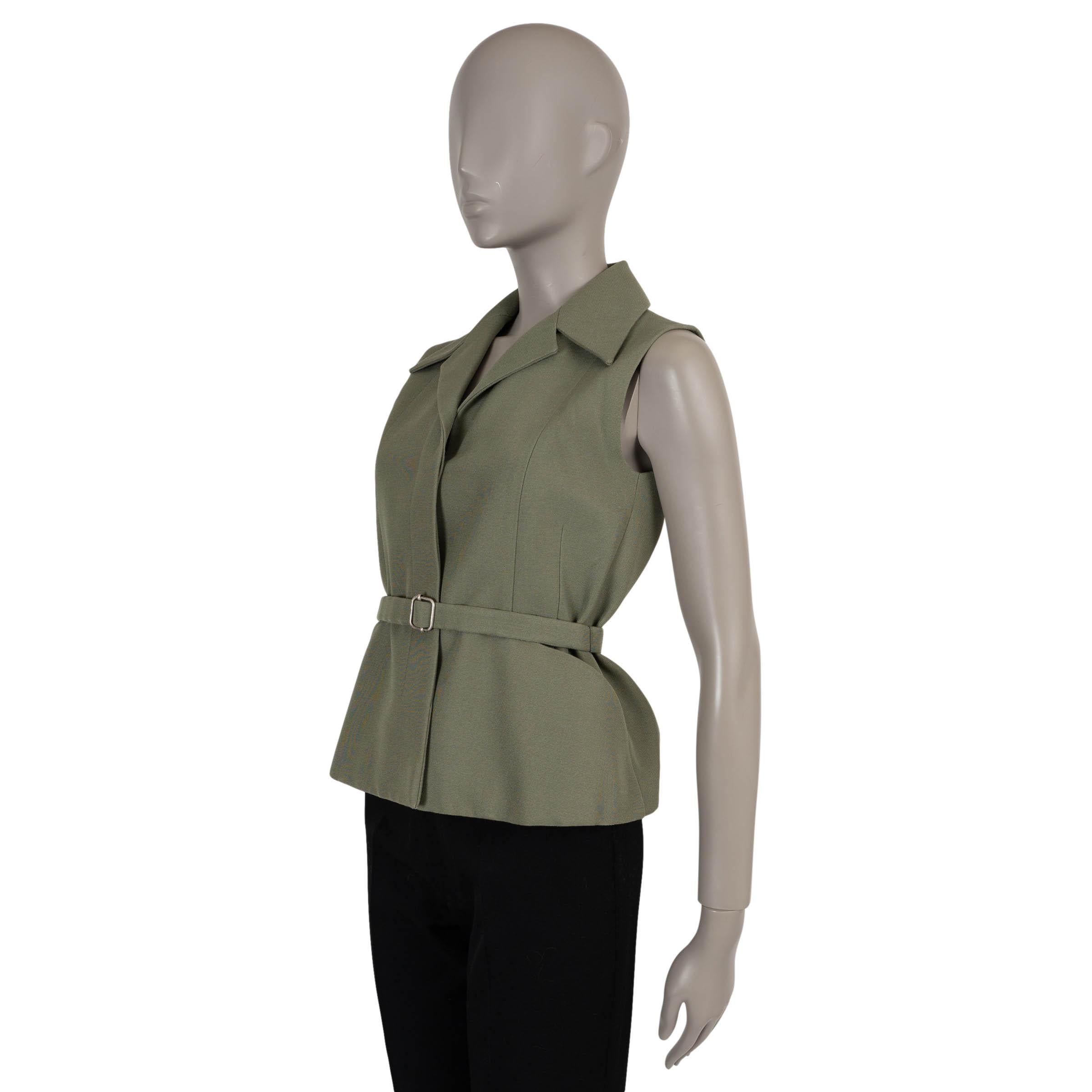 This 100% authentic Christian Dior Bar vest in military green faille silk (100%) reinterprets the iconic Bar silhouette with modern refinement. Designed with a tailored fit, it features a structured pointy spread collar and two open pockets at the
