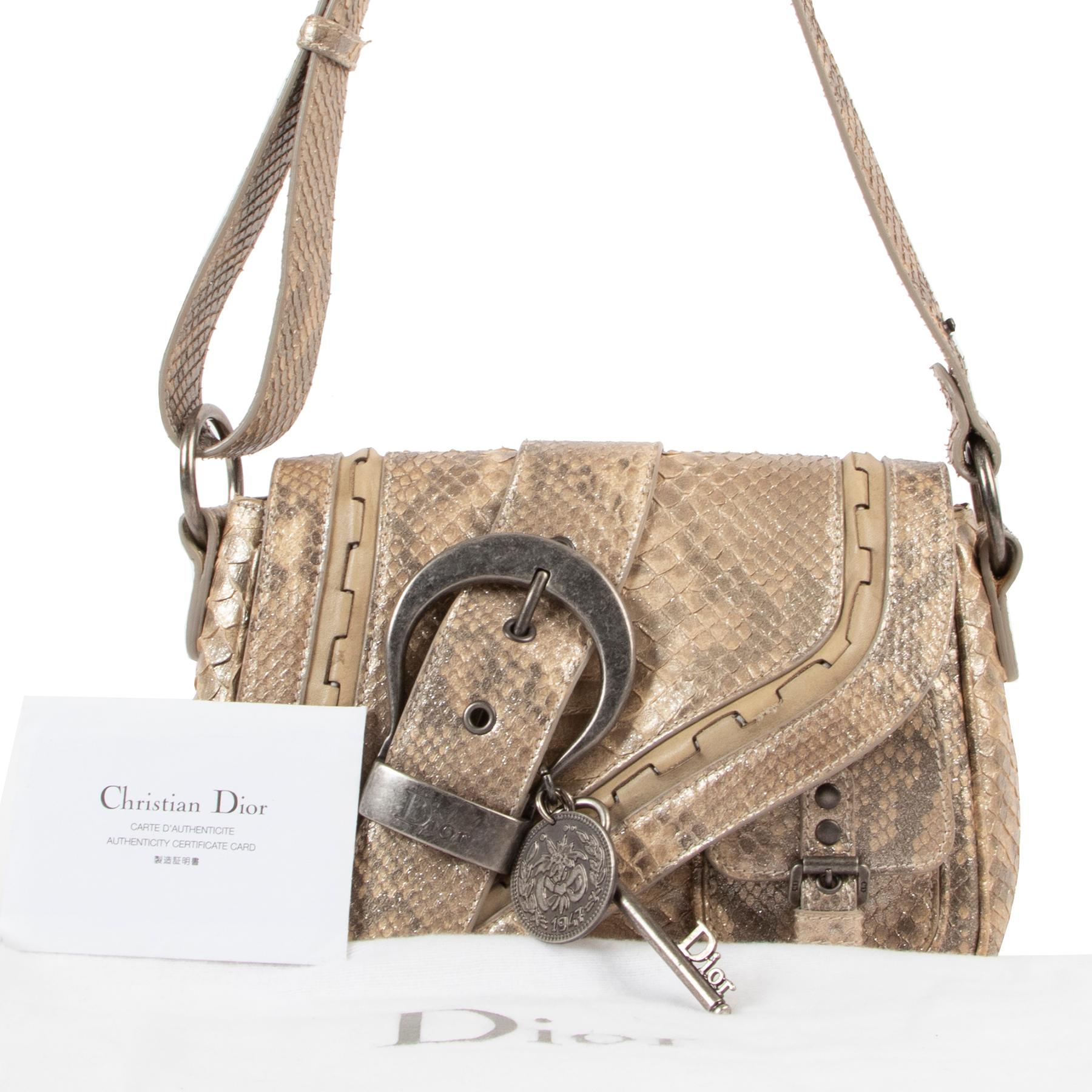 Christian Dior Mini Gaucho Saddle Limited Edition Glittering Python

This Christian Dior Glittering Python Mini Gaucho Bag is one of the most popular style created by John Galliano. It features gorgeous glittering 