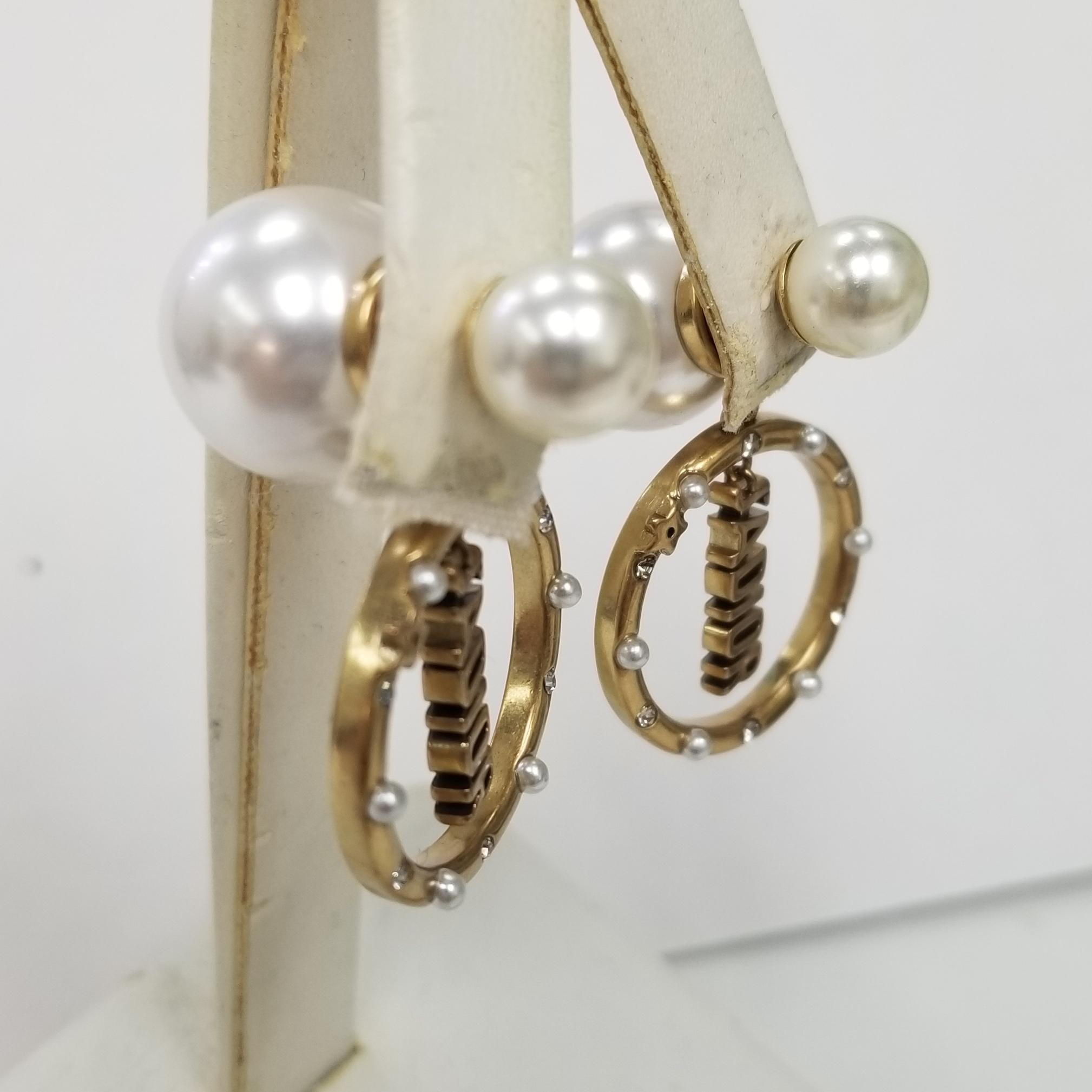 Christian Dior large & small fuax pearl jadior w/ crystal set in circle earring.
Christian Dior Faux Pearl Mise En Dior Tribal Earrings
