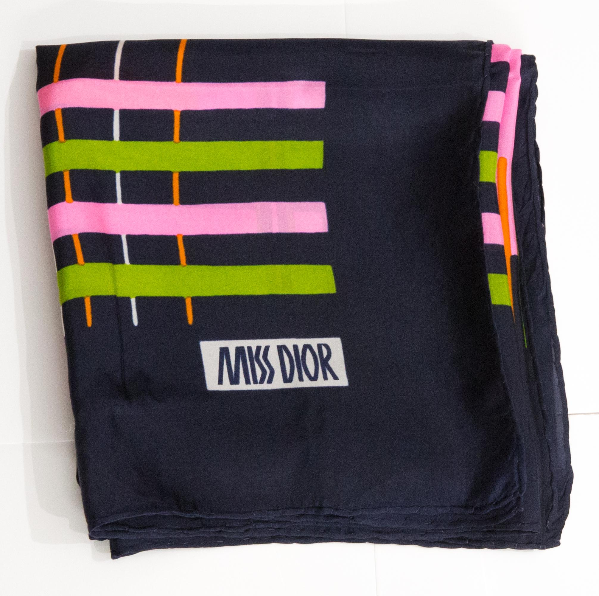 1960s Christian Dior Silk Scarf featuring Navy and multicolor stripes, a multico stripy patern, a navy border, a Miss Dior signature. 
Circa 1960s
In good vintage condition. Made in France.
30.5in (76cm)  X 30.5in (76cm)
We guarantee you will