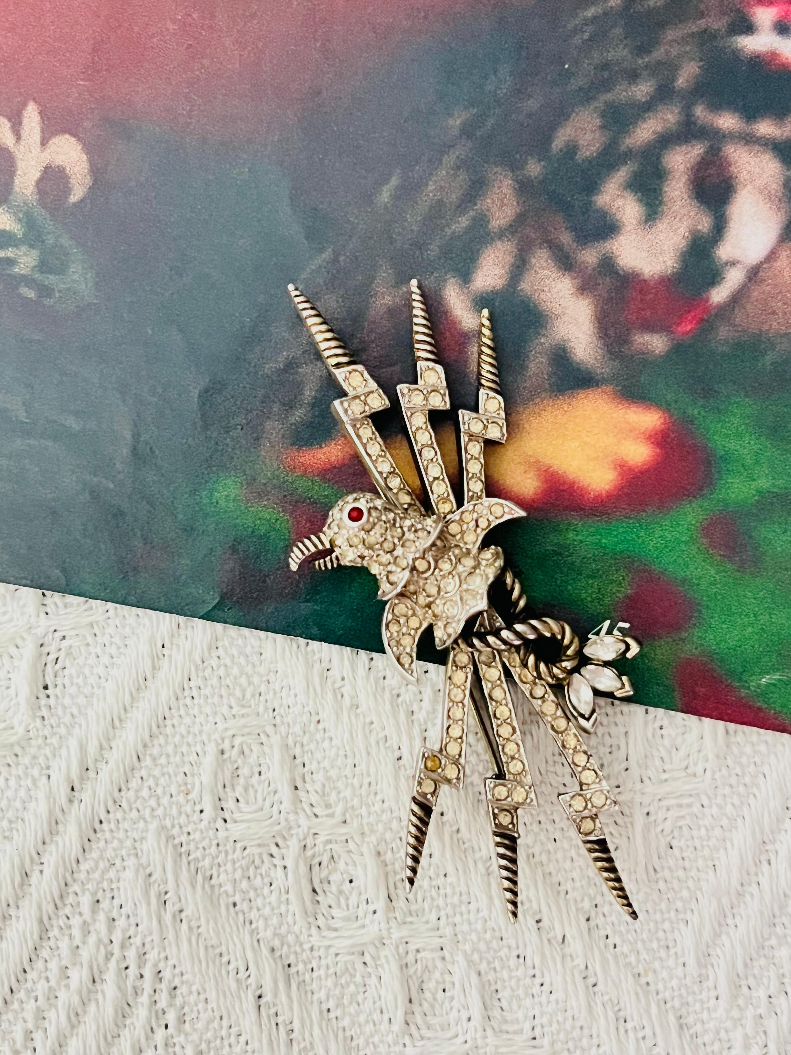 Christian Dior Mitchel Maer 1950s Vintage Large Long Vivid Ruby Red Eye Bird Penguin Whole Crystals Three Trio Lightning Modernist Brooch, Silver Plated

Mitchel Maer was a prominent American designer who lived in England during the 1950s. During