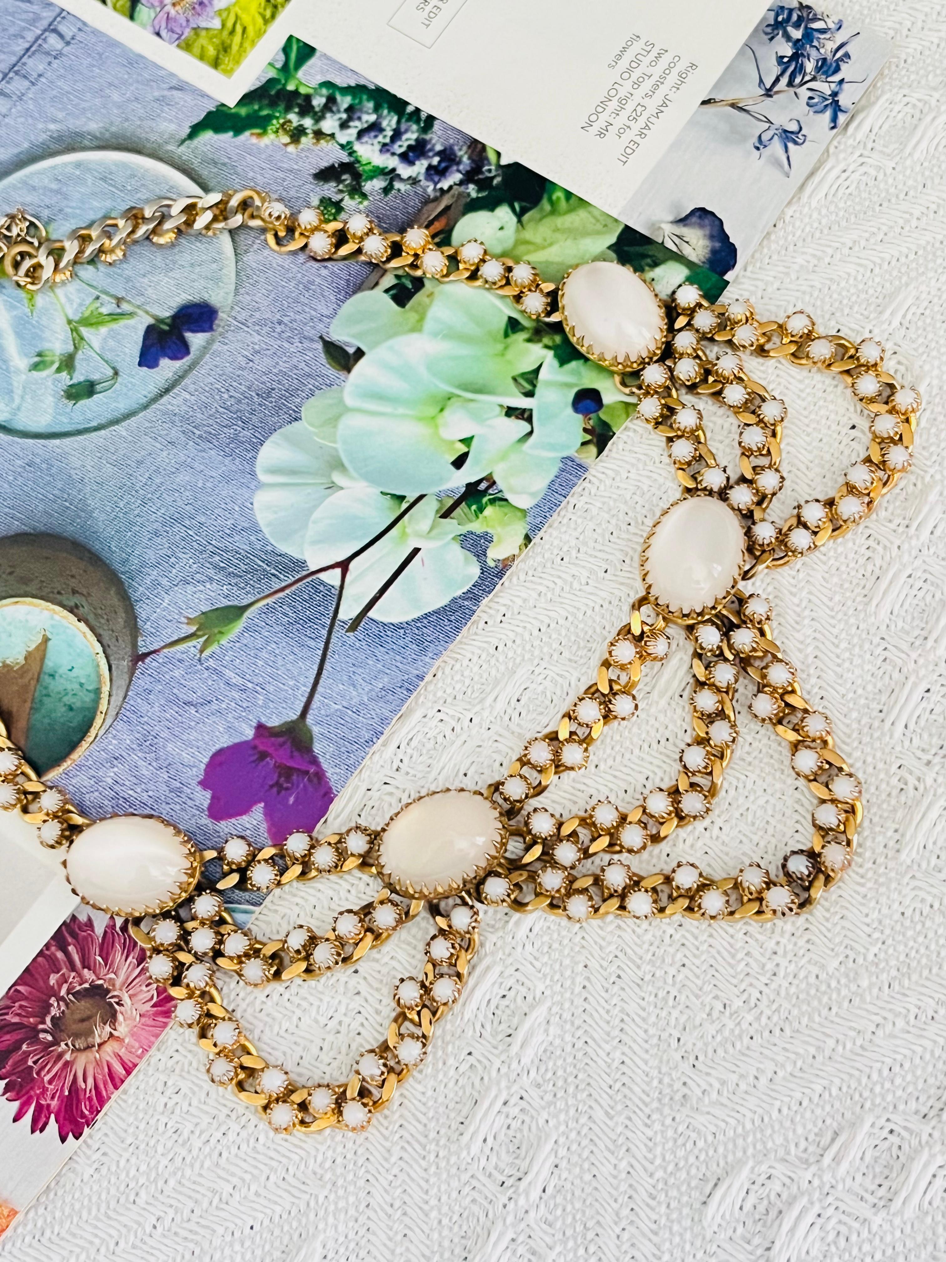 Christian Dior Mitchel Maer 1950s Vintage Oval Moonstones Milky Cabochon Crystals 3 Layers Strands Round Circle Beads Elegant Necklace, Gold Plated

Mitchel Maer was a prominent American designer who lived in England during the 1950s. During this