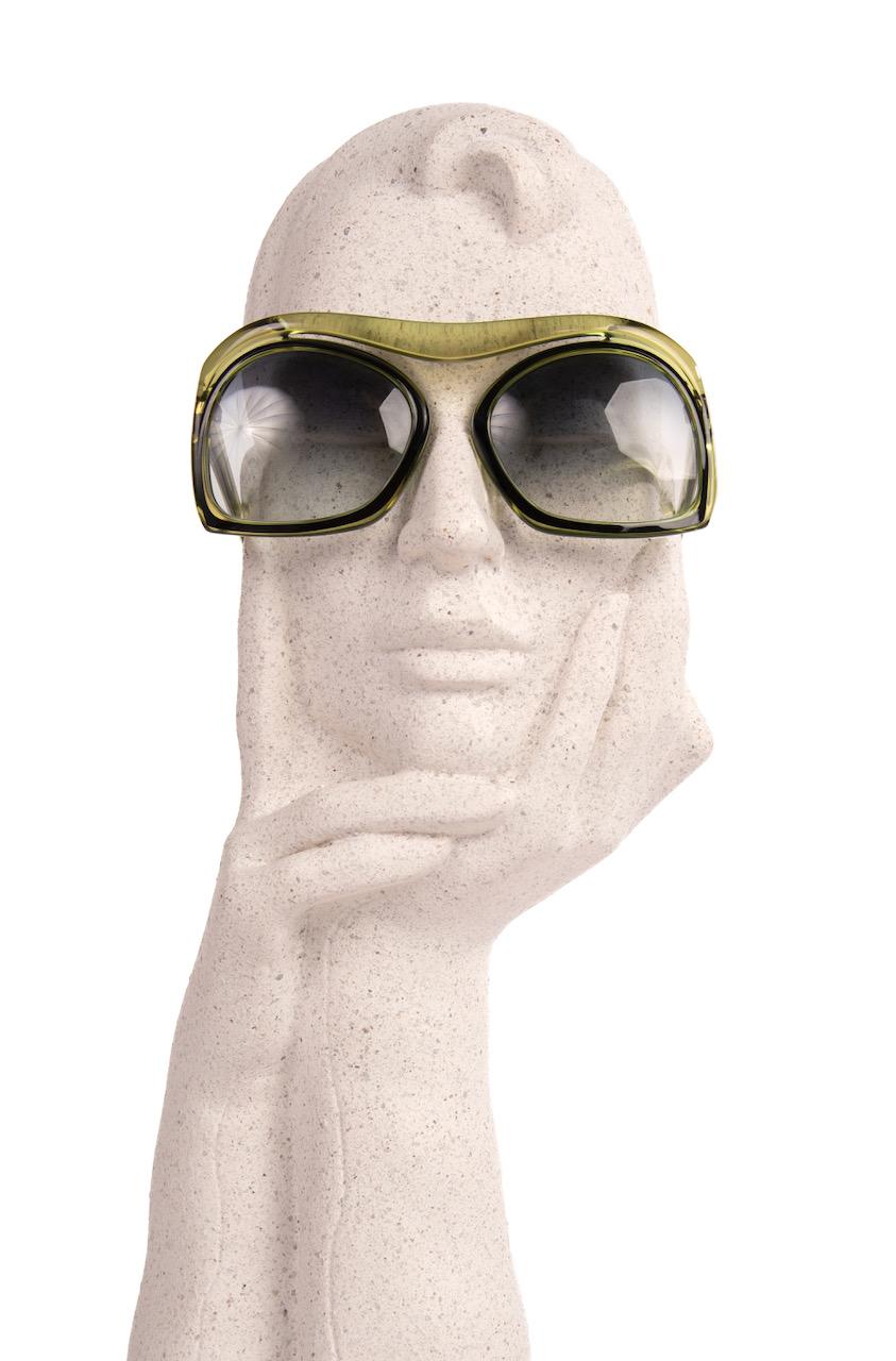 These extraordinary 1980s Christian Dior model 2043 sunglasses feature a bridgeless oversized translucent green (colour 50) frame with black accents.

I am happy to have found documentation of them in another colour in a Christian Dior eyewear