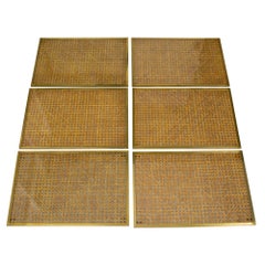 Tovagliette e sottopiatti Christian Dior in rattan e ottone in stile modernista, 6 pezzi, intorno al 1970