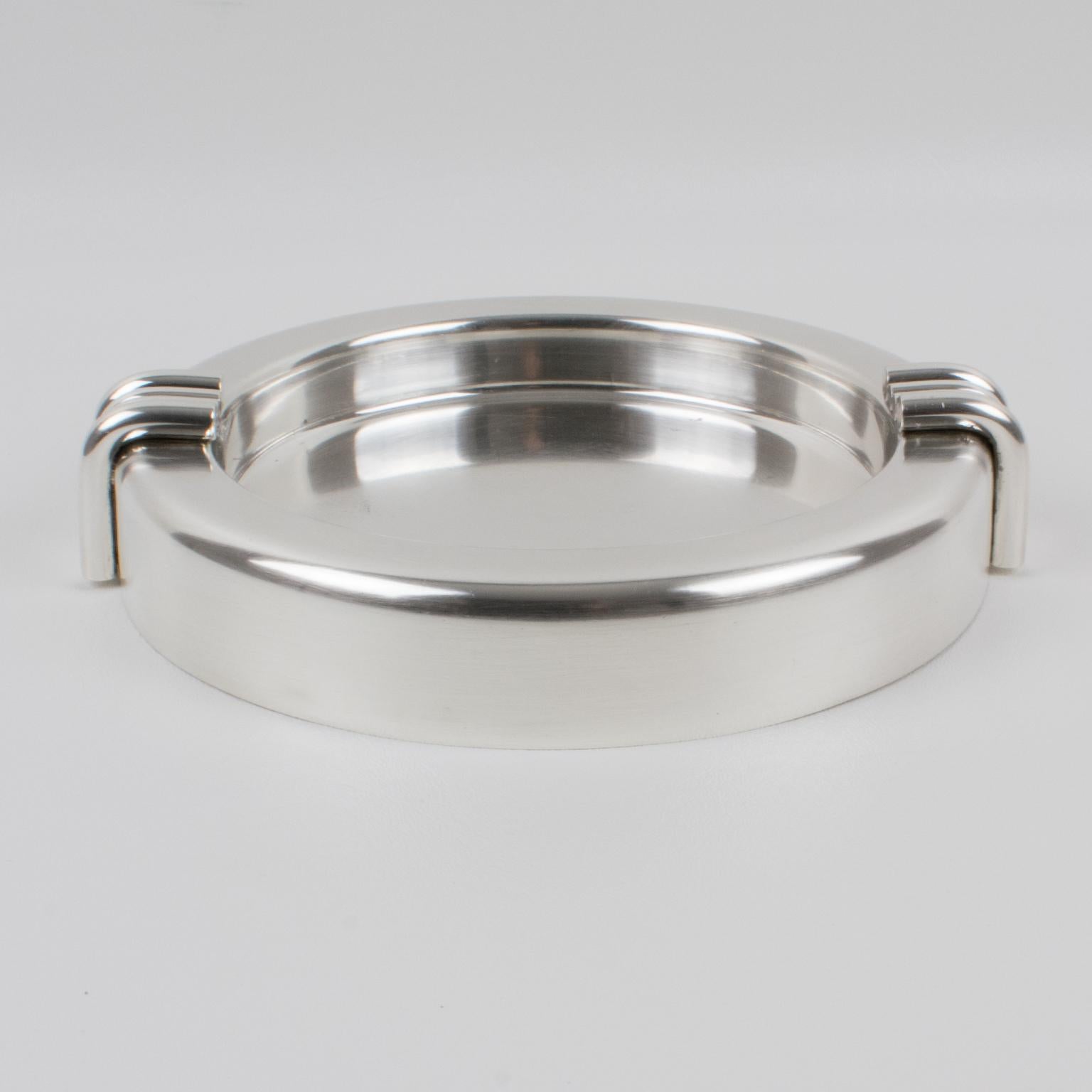 Elegant Christian Dior, Paris modernist large cigar ashtray or desk accessory. This silverplate sophisticated catchall features an iconic streamlined design with clean lines. Marked underside: Christian Dior.
Measurements: 7.88 in. diameter (20 cm)