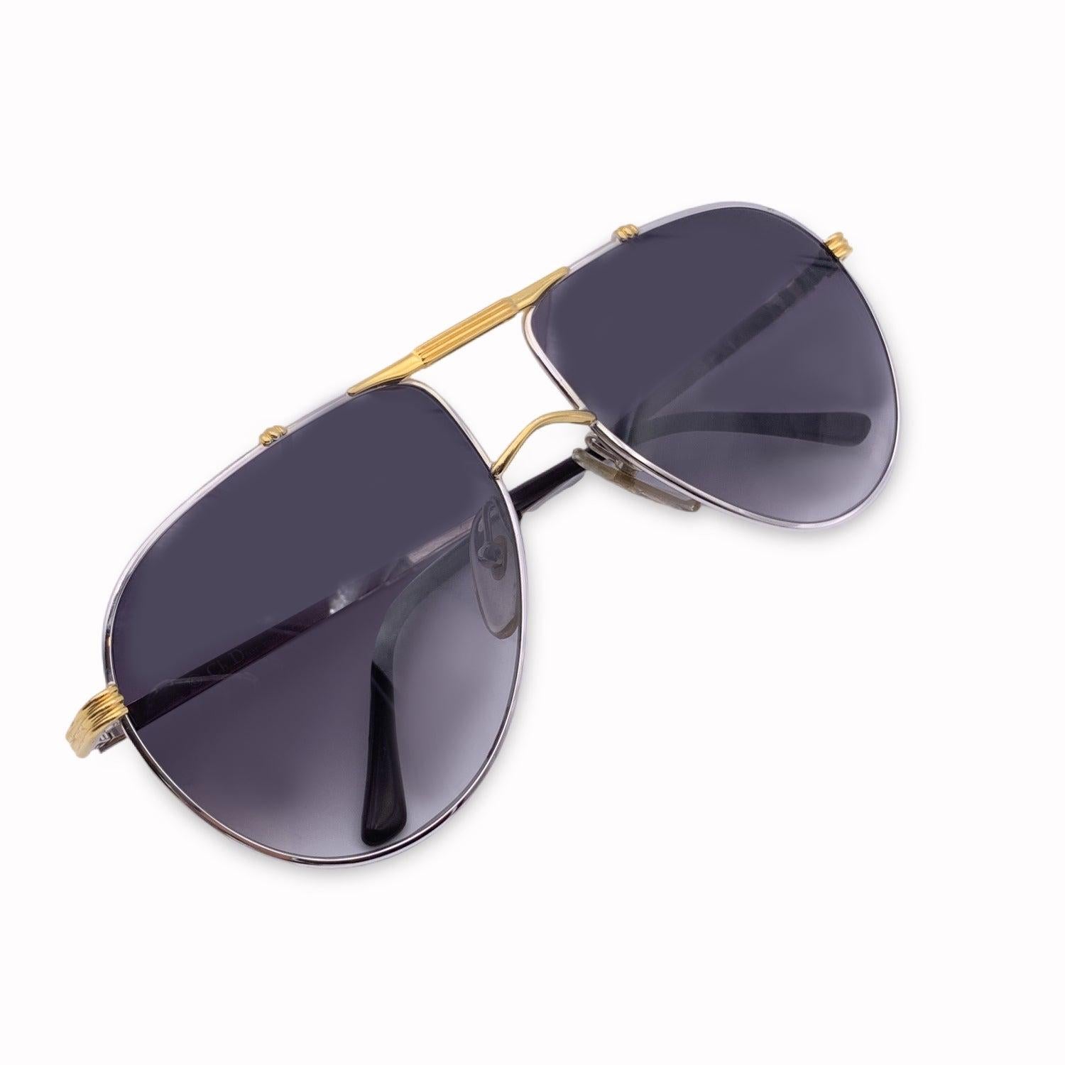 Vintage Christian Dior Monsieur Unisex Sunglasses, 2248 74. Size: 58/17 130mm. Silver metal frame, with gold details on sides and between lenses. CD logo on temples. 100% Total UVA/UVB protection. Grey gradient lenses. Details MATERIAL: Metal COLOR: