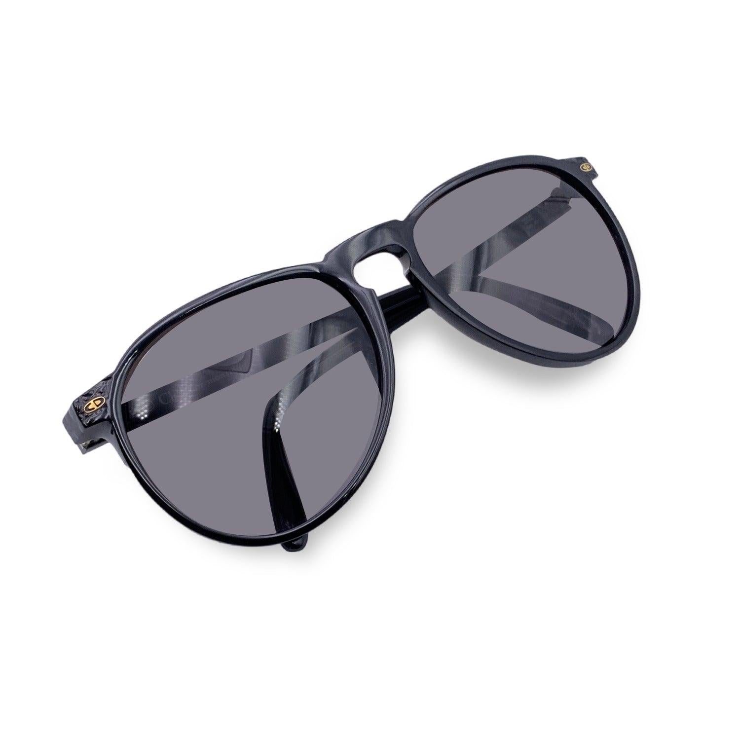 Vintage Christian Dior Monsieur Unisex Sunglasses, Mod. 2315 90 Optyl. Size: 60/14 135mm. Black acetate frame, with marble effect on the sides. 100% Total UVA/UVB protection grey gradient lenses. CD logos on the side front. Details MATERIAL: Plastic