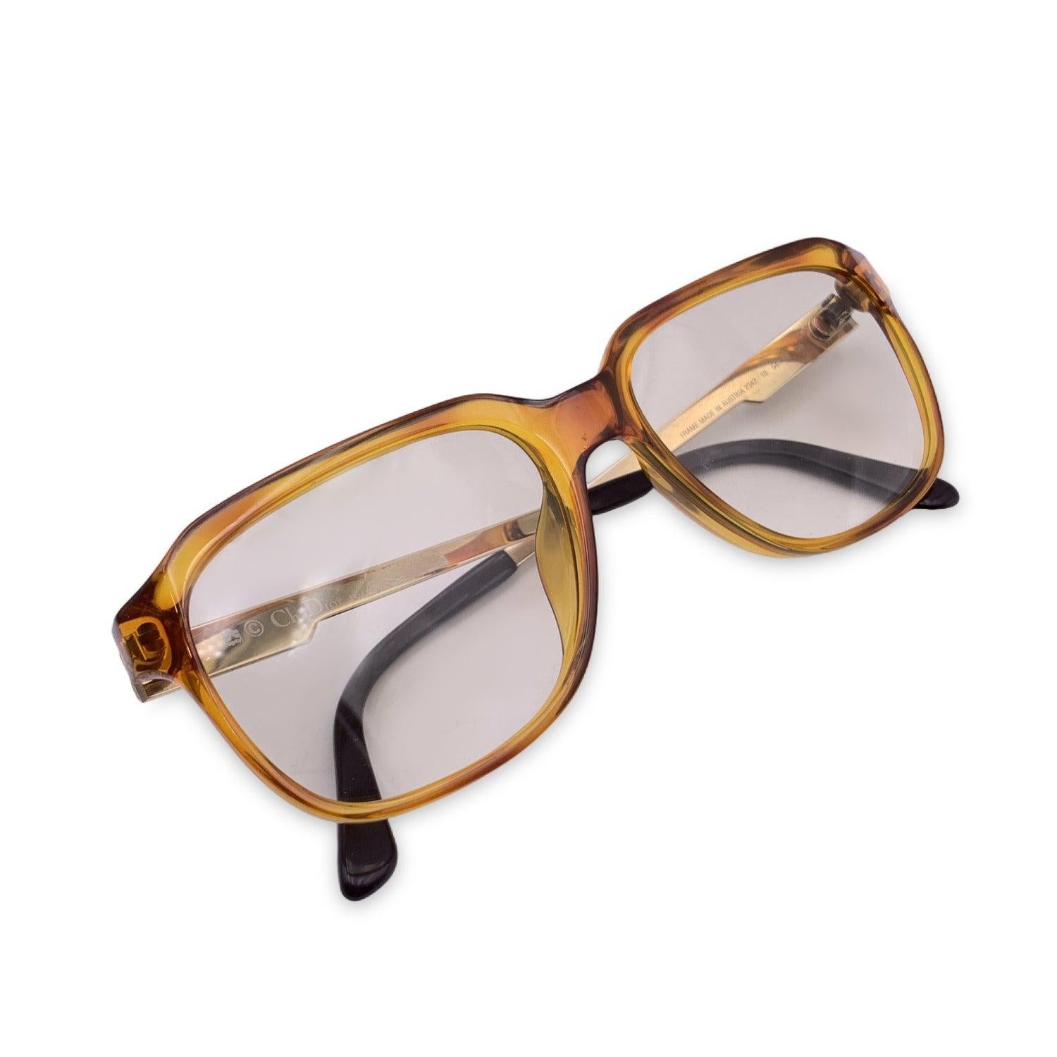Vintage Christian Dior Monsieur Unisex Sunglasses, Mod. 2342 10 Optyl. Size: 54/16 135mm. Honey color acetate frame, with gold metal finish on the sides. . 100% Total UVA/UVB protection. Very light yellow gradient lenses. CD logos on temples.
