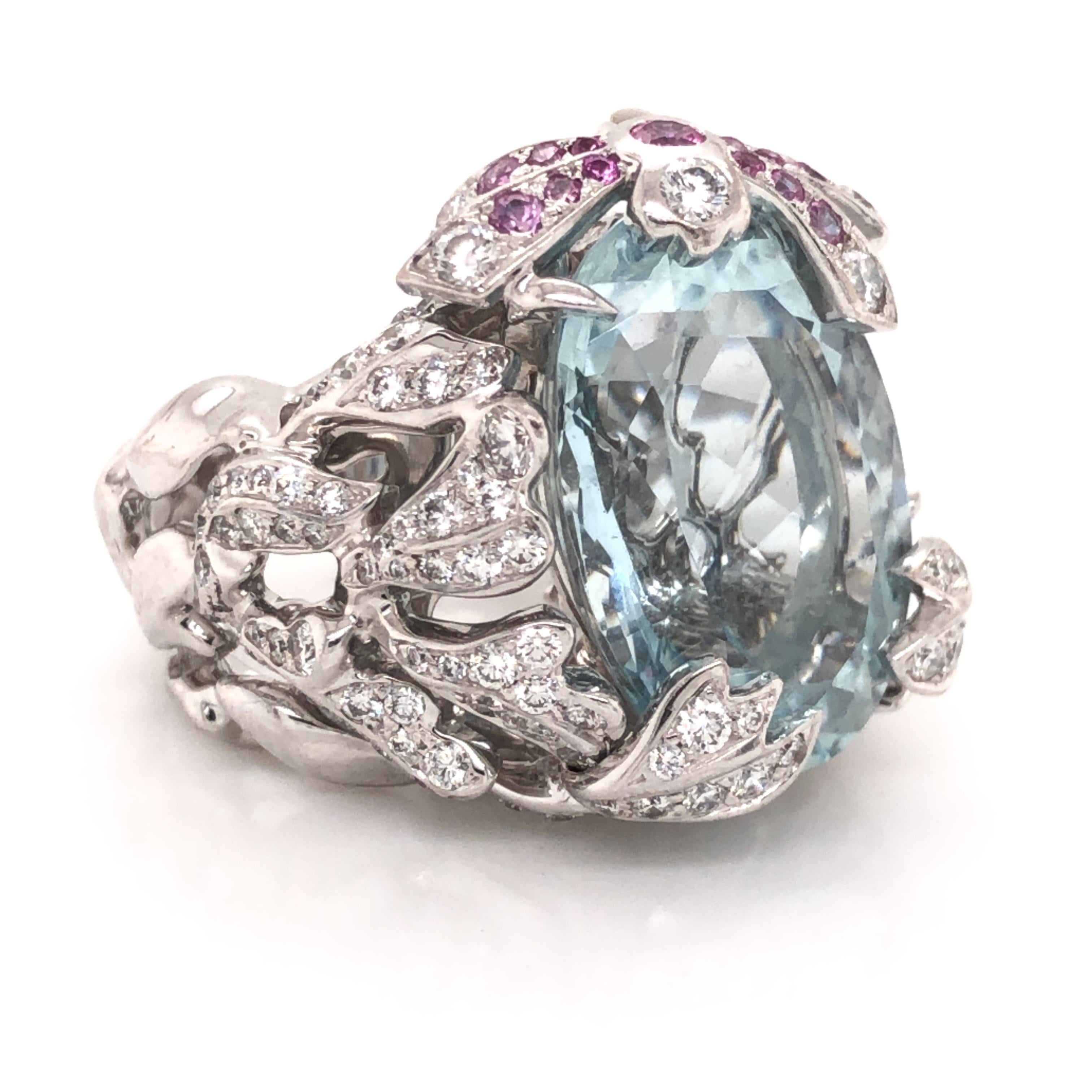 Amazing creation from famed designer Chritian Dior. This gorgeous ring is highlighted with one aqua marine gemstone set in the center, oval in shape that is approximately 18-20 ct. Details in this ring are phenomenal as the design is covered in