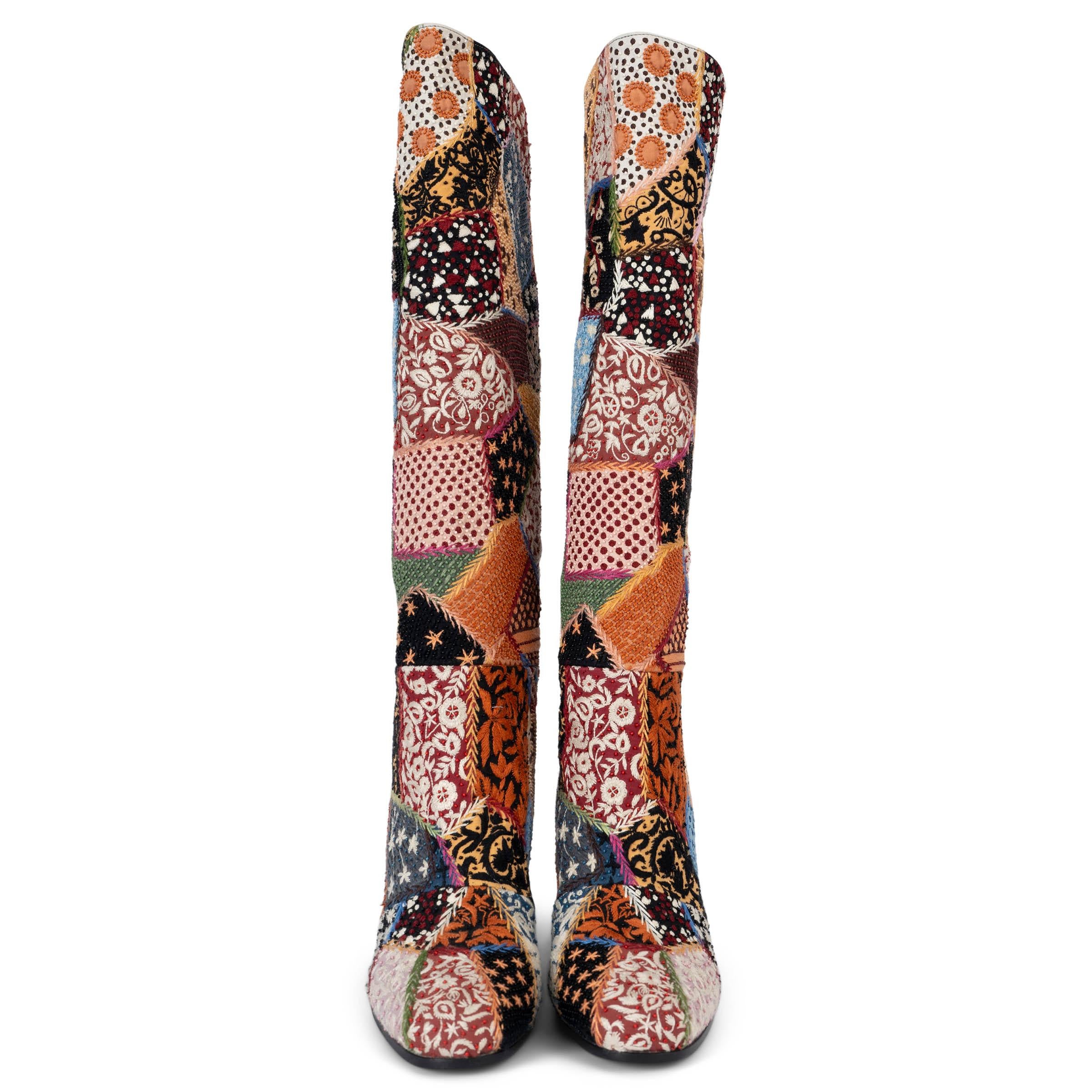 These 100% authentic Christian Dior Diorage boots are crafted from multicolored fabric and fully embroidered with intricate patchwork details, including the 