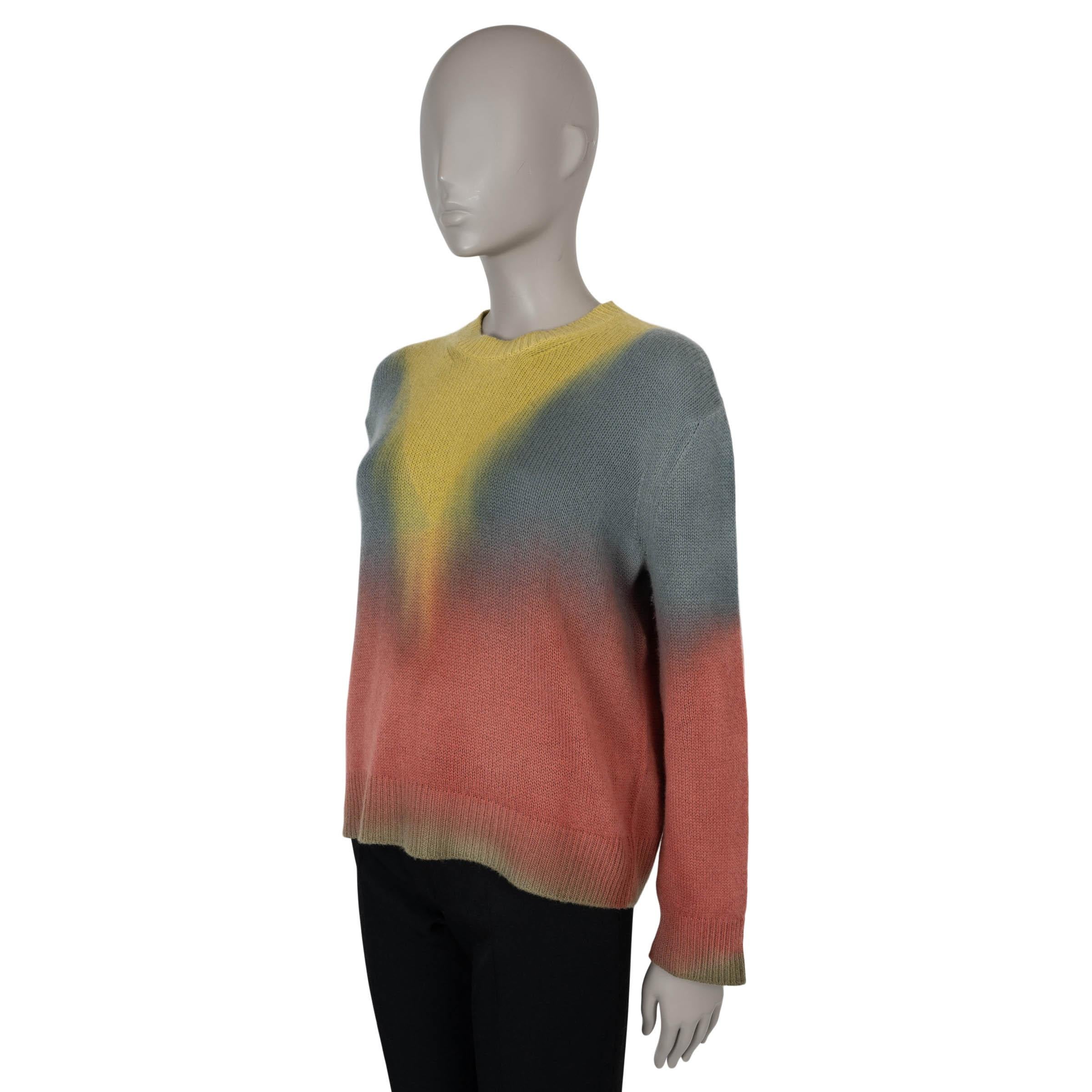This 100% authentic Christian Dior DiorAura sweater in multicolor tie-dye cashmere (100%) blends effortless luxury with a bold, artistic touch. Designed with a relaxed silhouette, it features dropped shoulders, a classic crewneck, and rib-knit trims