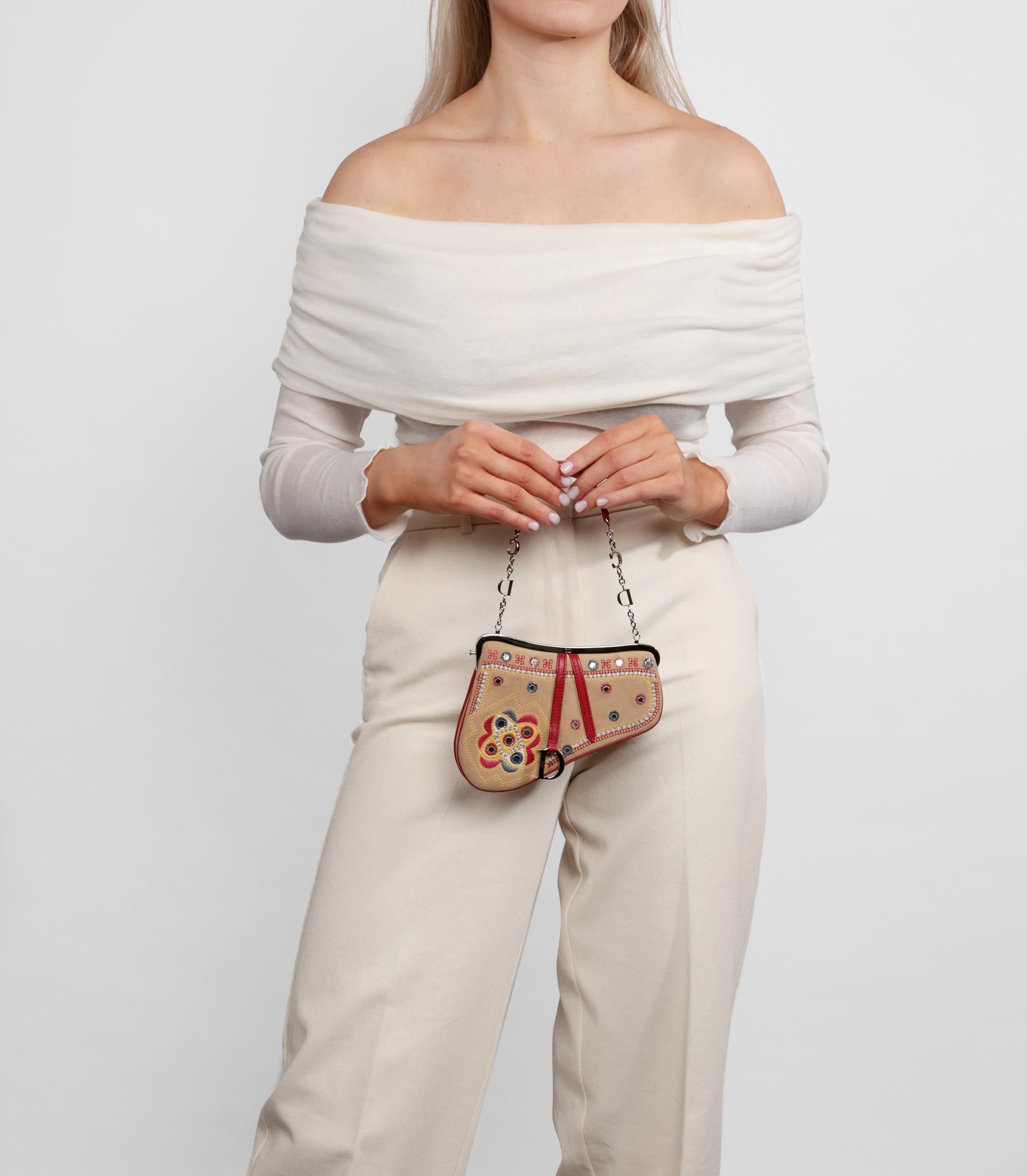 Brand: Christian Dior
Model: Mini Saddle Bag
Product Type: Top Handle
Serial Number: 09*******
Age: Circa 2003
Accompanied By: Christian Dior Dust Bag, Mirror
Colour: Beige
Hardware: Silver
Material(s): Suede, Calfskin Leather
Authenticity Details: