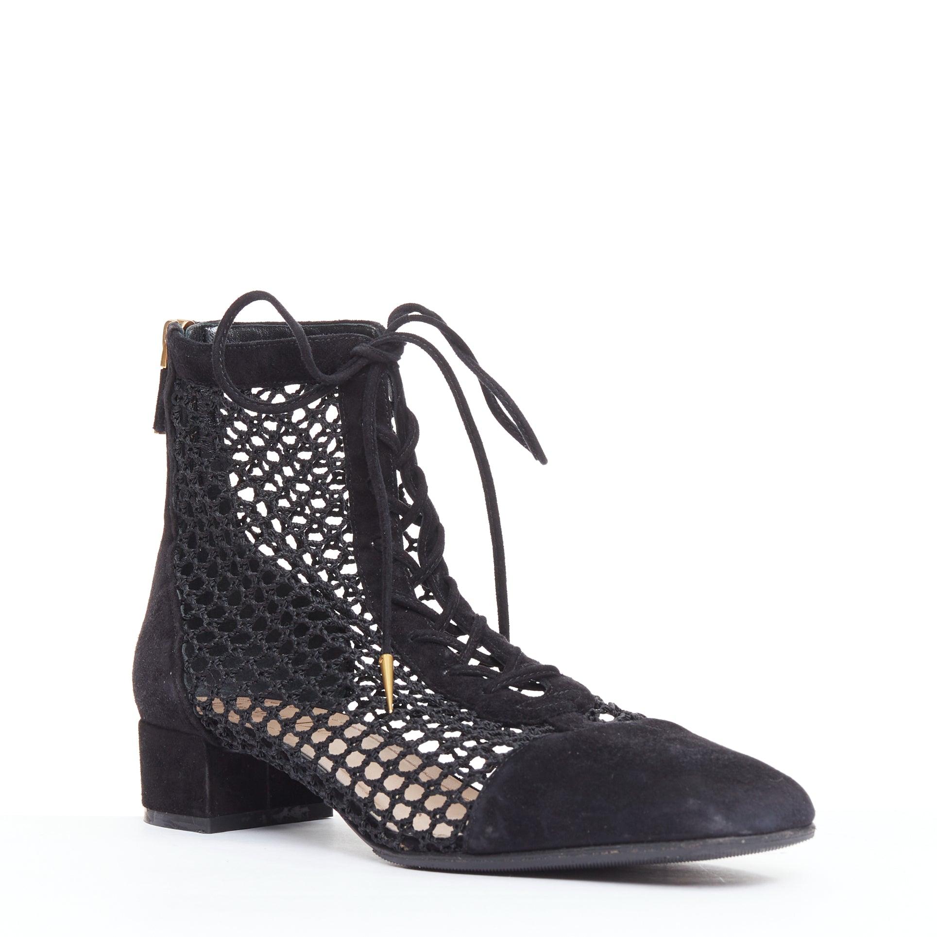 CHRISTIAN DIOR Naughtily-D black suede caged lace up ankle boots EU37.5
Reference: NILI/A00102
Brand: Dior
Designer: Maria Grazia Chiuri
Model: Naughtily-D
Material: Suede, Mesh
Color: Black
Pattern: Solid
Closure: Lace Up
Lining: Nude Leather
Made