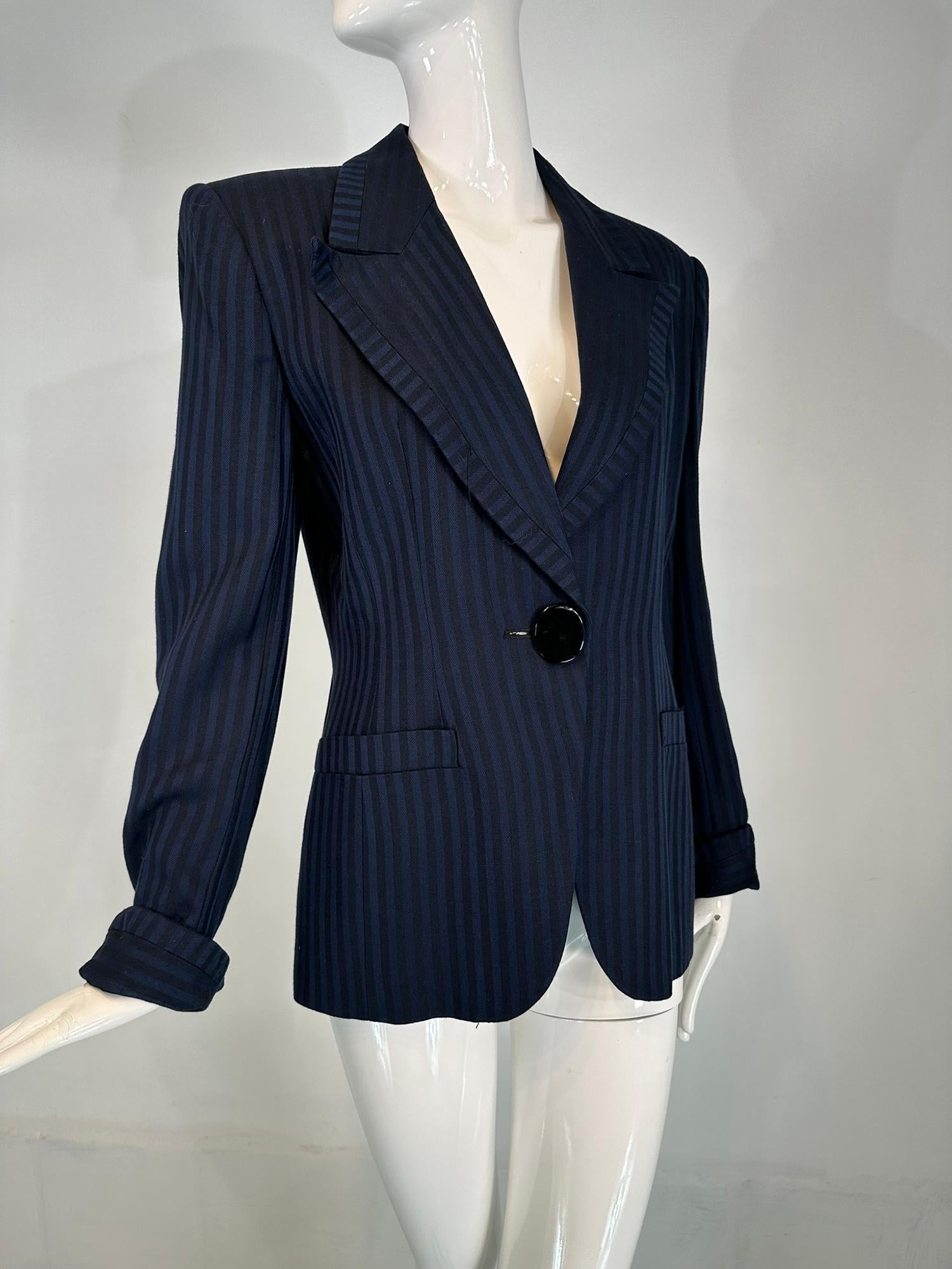 Christian Dior navy Blue & black wide stripe wool twill jacket late 1990s early 2000s. Large black oval single button waist front closure. Wide notched lapels are are faced with a band of counter set stripe fabric. Long sleeves with turn back cuffs