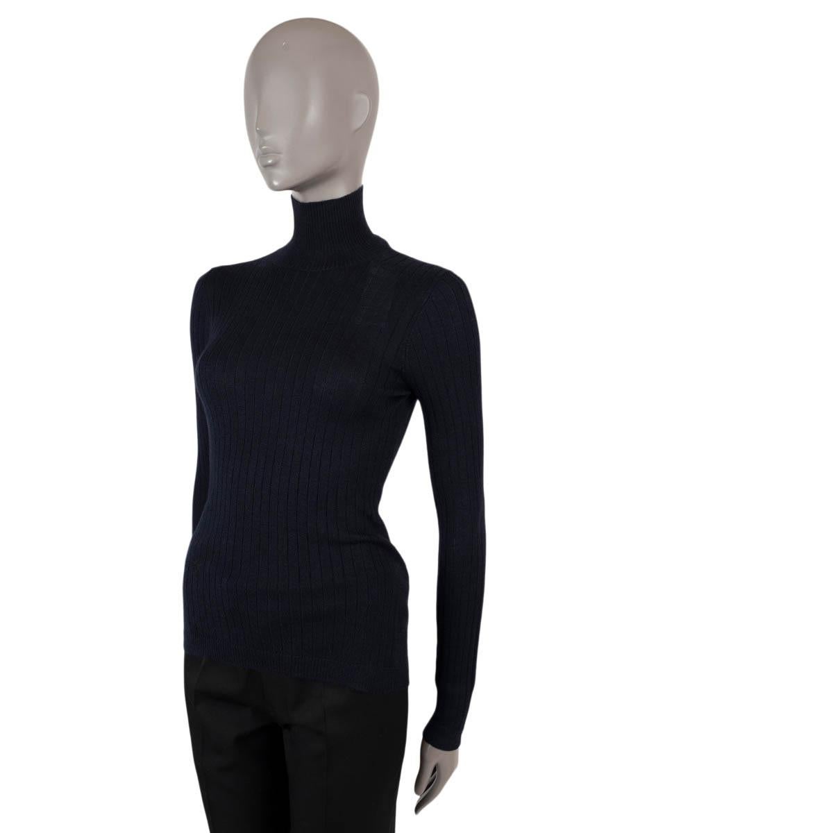 100% authentic Christian Dior rib-knit turtleneck sweater in navy blue cashmere (100% missing tag) featuring black embroidered bee emblem. Has been worn and is in virtually new condition.

Measurements
Tag Size	Missing
Size	S
Shoulder Width	35cm