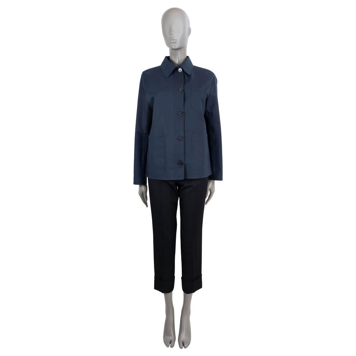 100% authentic Christian Dior Caro jacket in midnight blue coated cotton (100%). Features a straight, oversized silhouette, three patch pockets and bee embroidery. Closes with buttons on the front and is lined Dior Oblique jacquard (100%