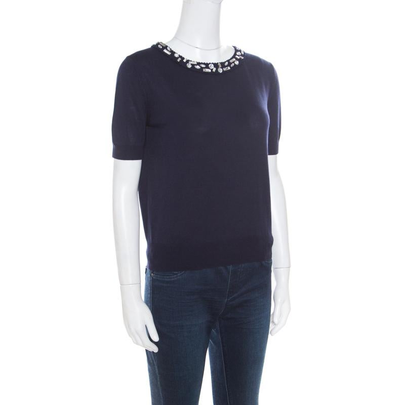 An apt choice for black-tie events and cocktail parties, this sweater top from Christian Dior features a navy blue hue along with a covetable silhouette and a beguiling embellished collar, looking accentuating against the solid base. Finished with a
