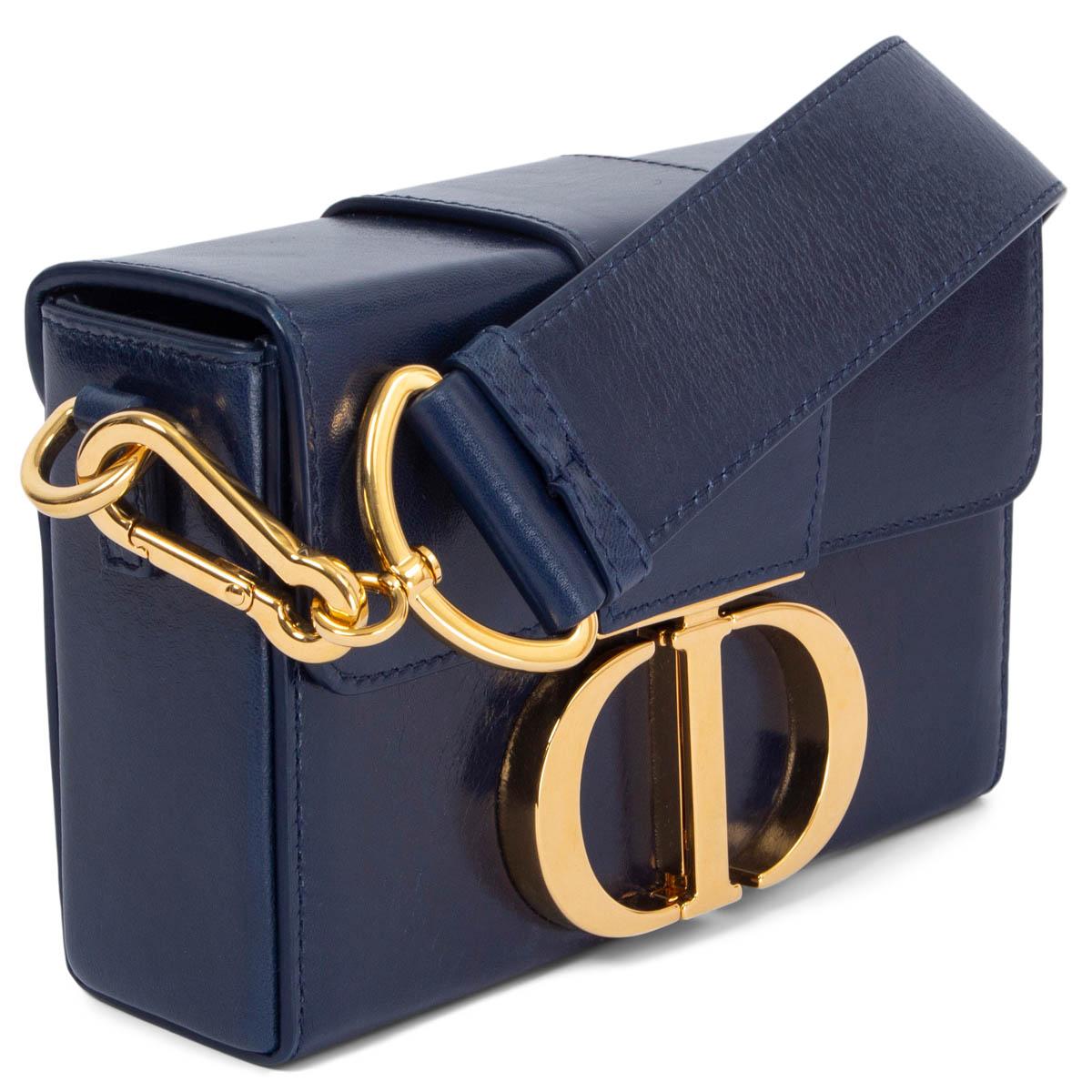100% authentic Christian Dior 30 Montaigne Box crossbody bag in softly wrinckled navy box calfskin. The flap has an antique gold-finish metal 'CD' clasp, inspired by the seal of a Christian Dior perfume bottle. Embossed '30 MONTAIGNE' signature at
