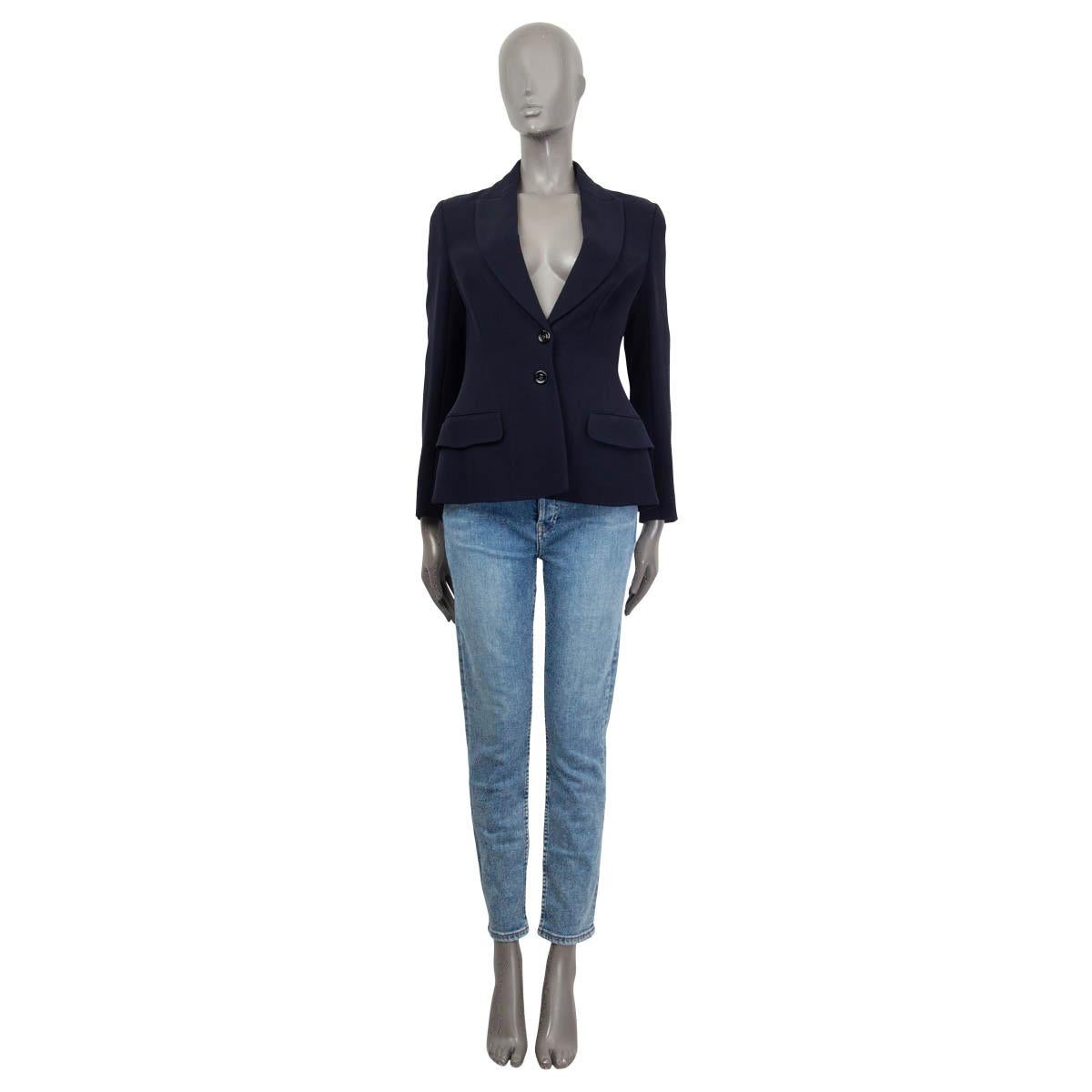 100% authentic Chanel Cruise 2013 classic single breasted blazer in navy blue silk (100%). Features two flap pockets on the front and buttoned cuffs. Opens with two buttons on the front. Semi-lined in black silk (100%). Brand new, with