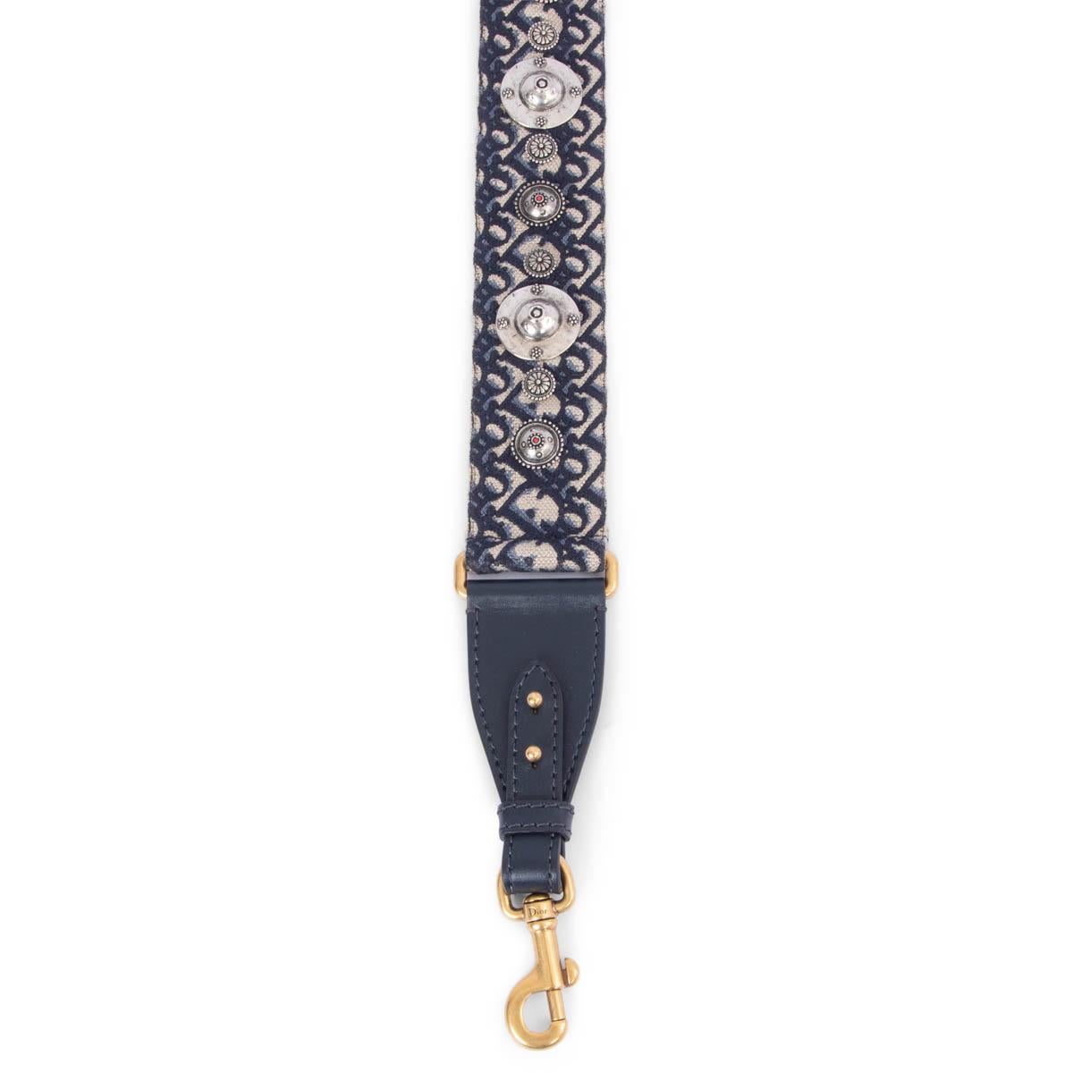 100% authentic Christian Dior silver-tone studded metal emblems Dior Oblique belt strap in navy blue and light grey canvas featuring gold-tone clasps with navy leather trimming. Has been carried and is in excellent condition.