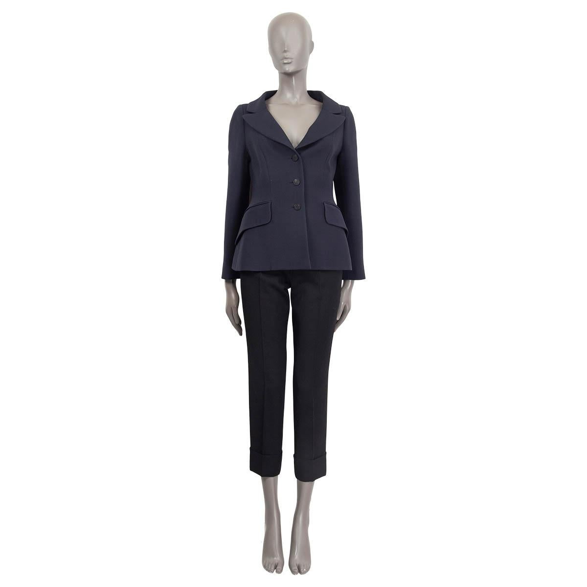 100% authentic Christian Dior classic blazer in midnight blue wool (77%) and silk (23%). Features buttoned cuffs, two patch pockets on the front and a notch collar. Opens with three buttons on the front. Lined in midnight blue silk (100%). Has been