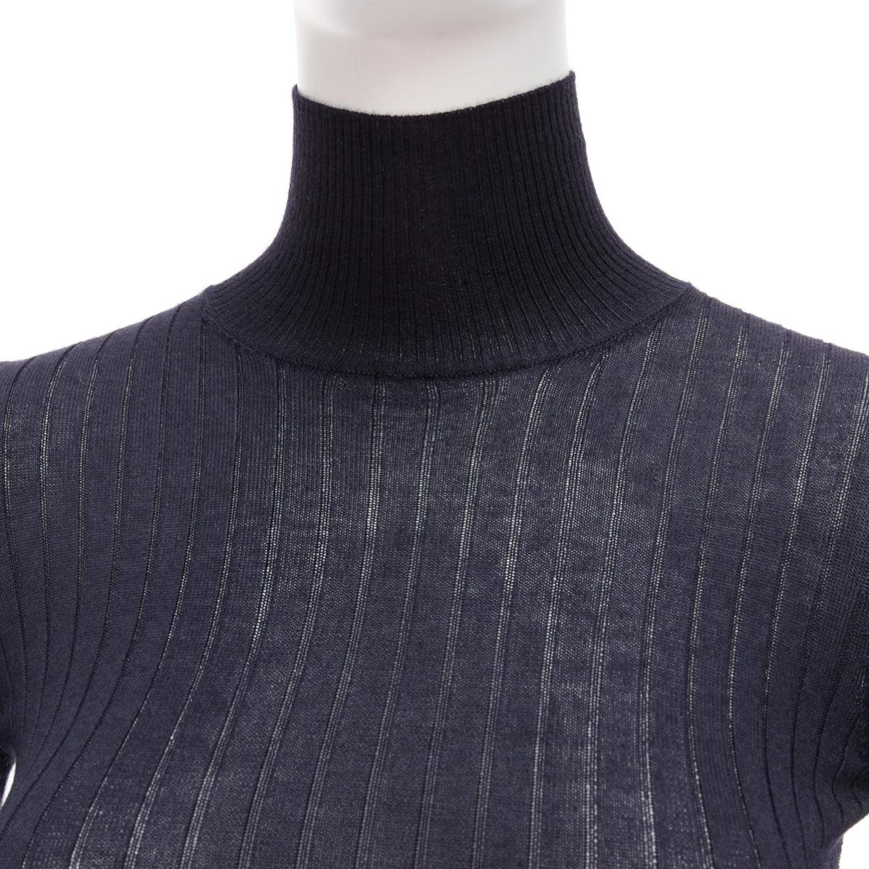 CHRISTIAN DIOR navy cashmere silk fine knit ribbed turtleneck sweater FR34 XS
Reference: AAWC/A00651
Brand: Christian Dior
Designer: Maria Grazia Chiuri
Material: Cashmere, Silk
Color: Navy
Pattern: Solid
Extra Details: Semi-sheer.
Made in: