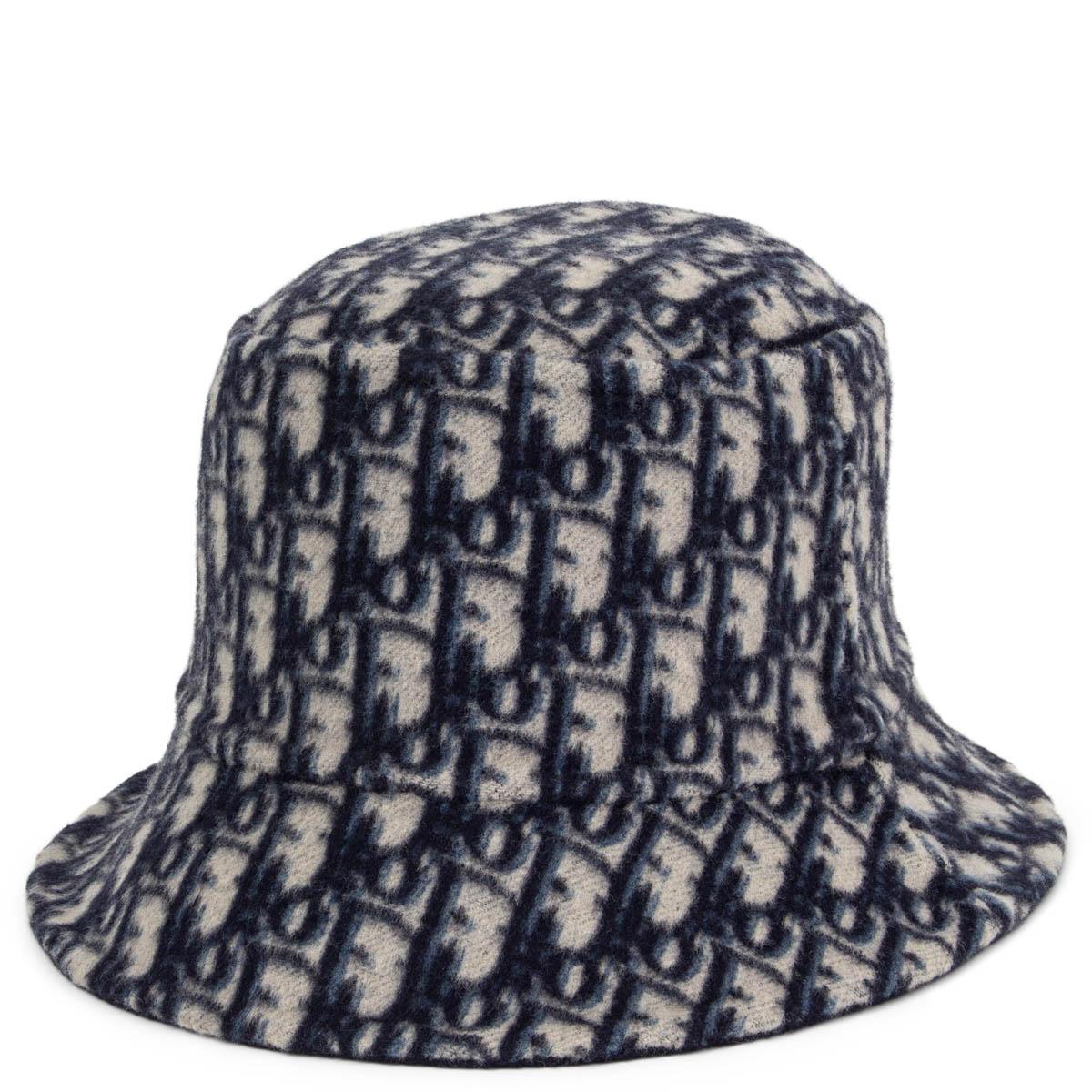 100% authentic Christian Dior Oblique reversible small brim bucket hat in navy and light grey wool (99%) and silk (1%). Has been worn once and is in virtually new condition. Comes with dust bag. 

Measurements
Tag Size	58
Inside Circumference	58cm