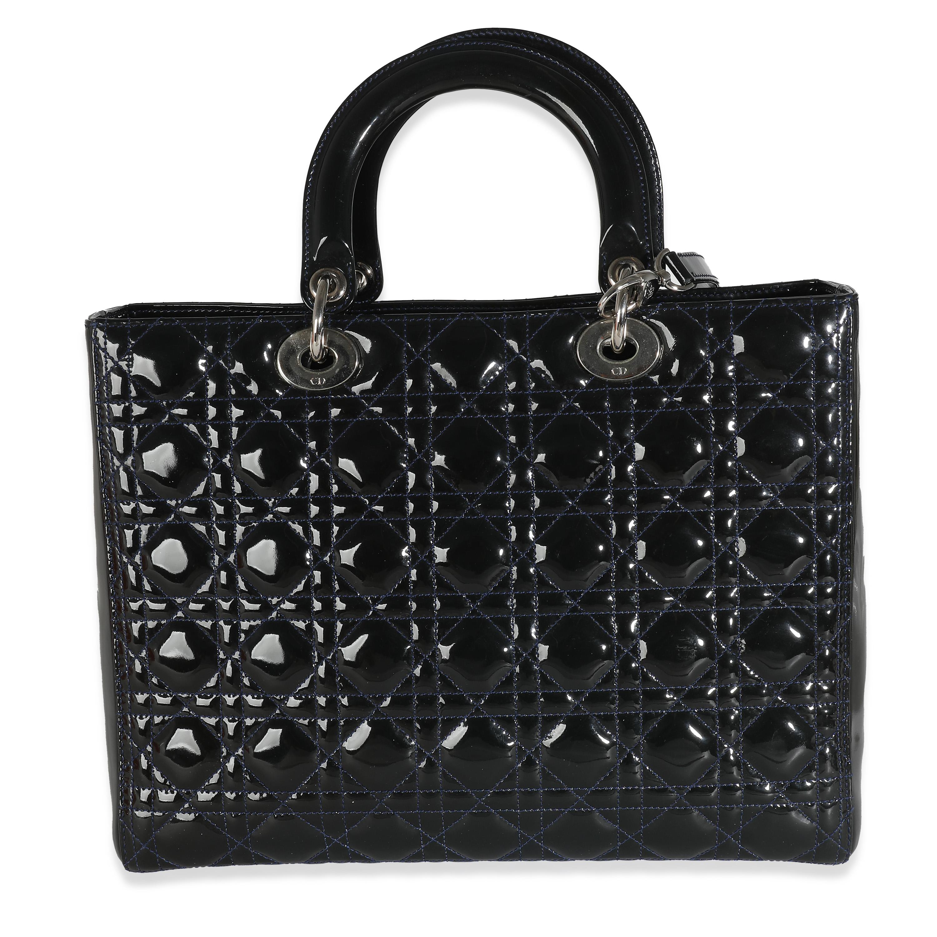 Listing Title: Christian Dior Navy Patent Cannage Large Lady Dior
SKU: 138114
Condition: Pre-owned 
Condition Description: Originally named the 'Chouchou', the Lady Dior bag from Dior was renamed after Princess Diana carried the bag at the Grand